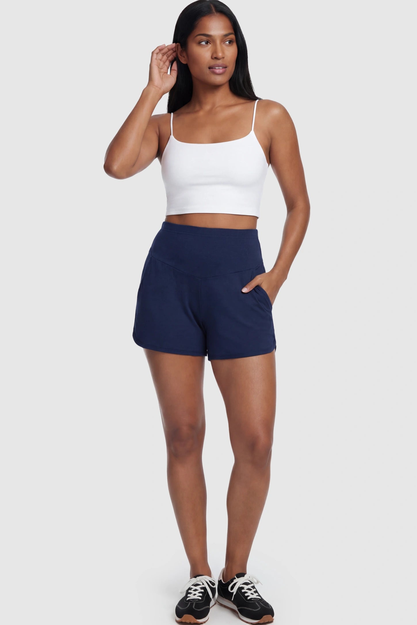 Full Panel Dolphin Hem Maternity Lounge Shorts Full Panel Maternity Lounge Shorts in Blue featuring a dolphin hem on a postpartum model.