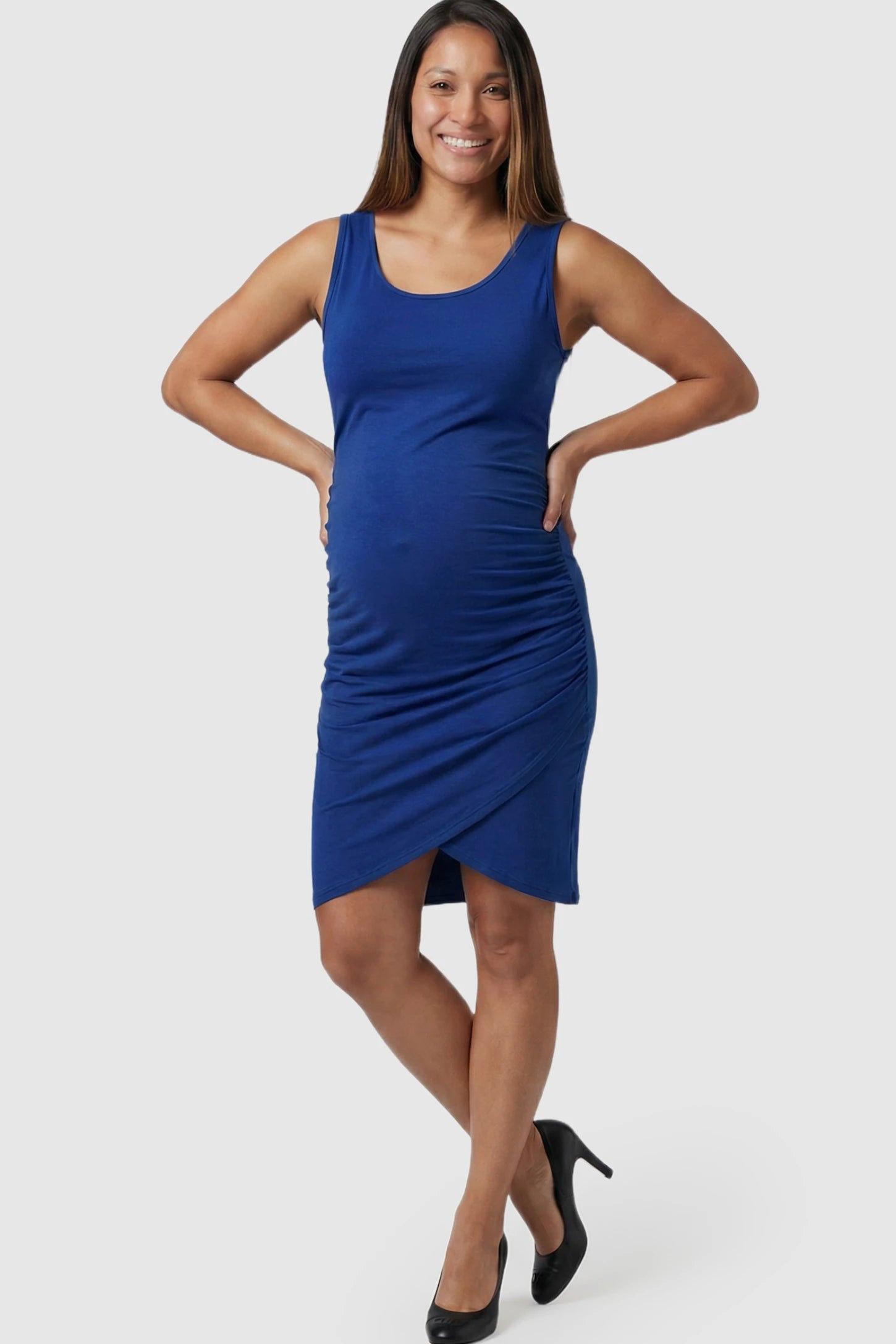 Ruched Tulip-Hem Bodycon Maternity Dress in Navy Blue featuring a side-ruched pencil skirt on a pregnant model.