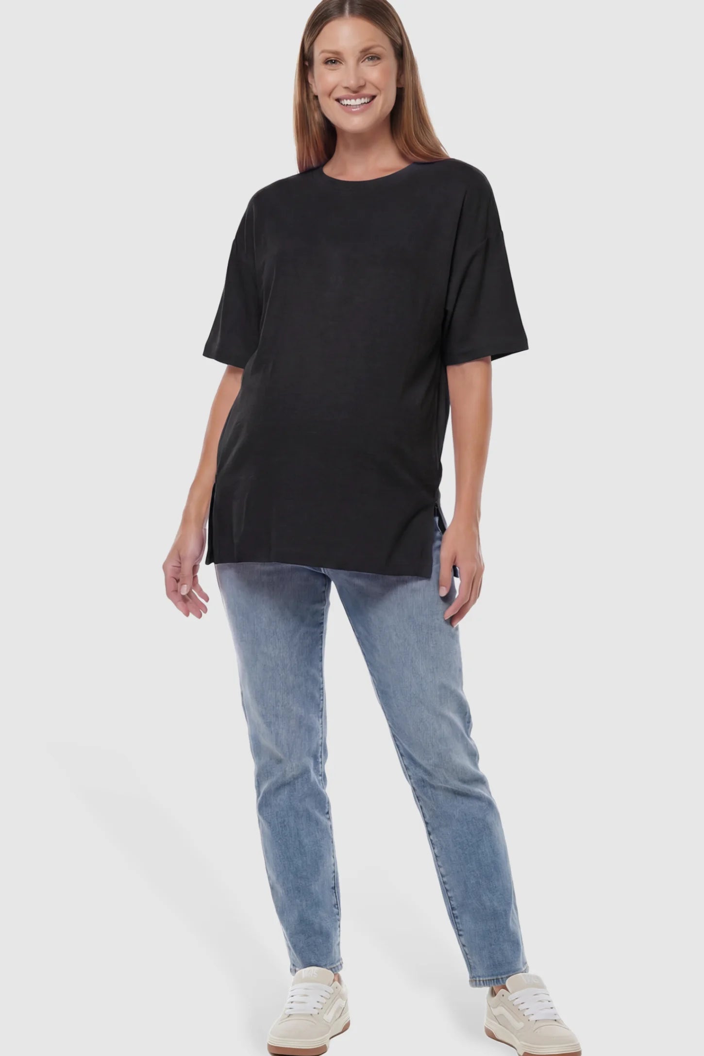 Oversized Short Sleeve Maternity T-Shirt Textured Oversized Short Sleeve Maternity T-Shirt in Black featuring a side-slit hem and drop shoulders on a model.