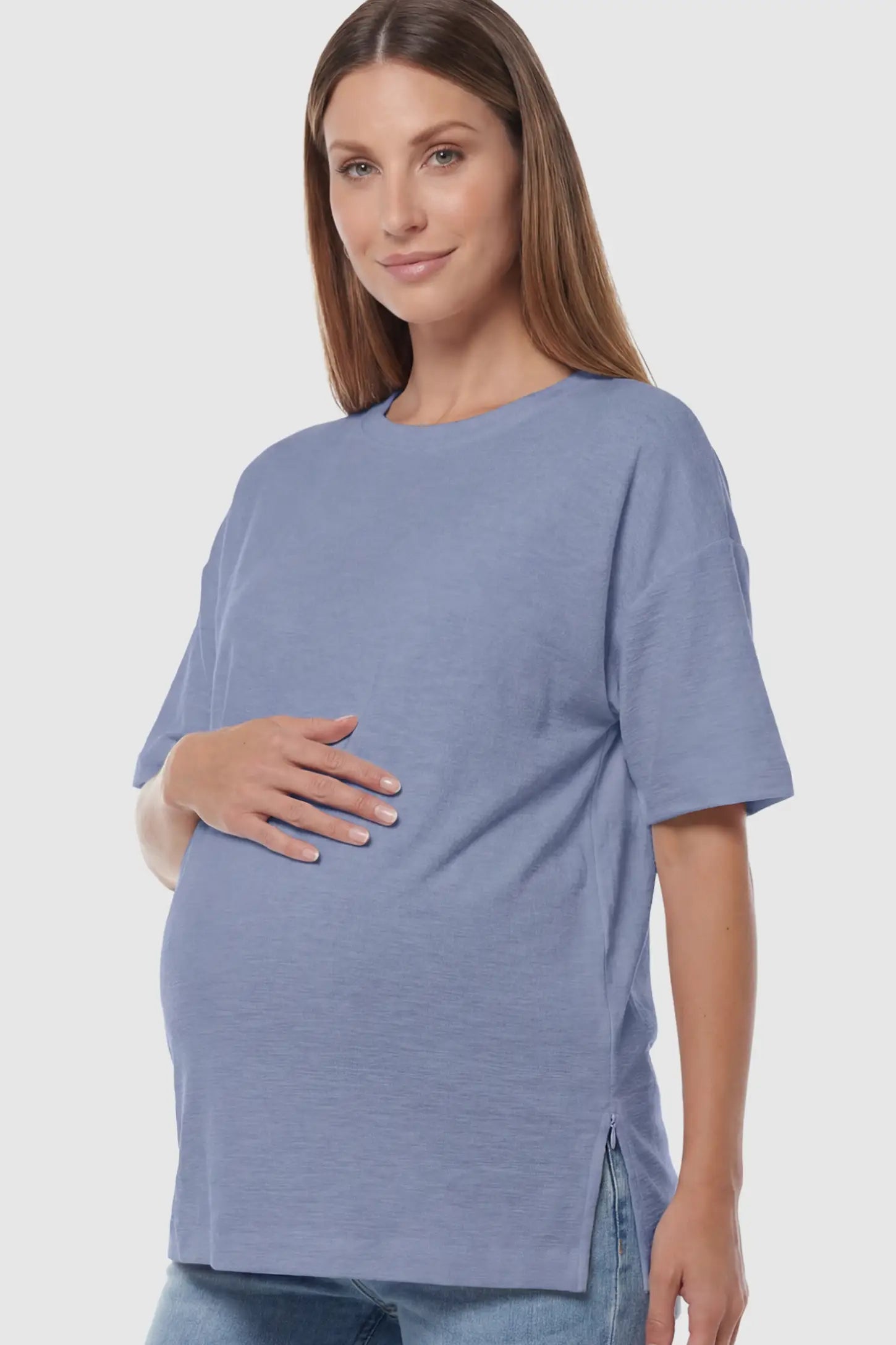 Oversized Short Sleeve Maternity T-Shirt Textured Oversized Short Sleeve Maternity T-Shirt in Light Blue featuring a side-slit hem and drop shoulders on a model.