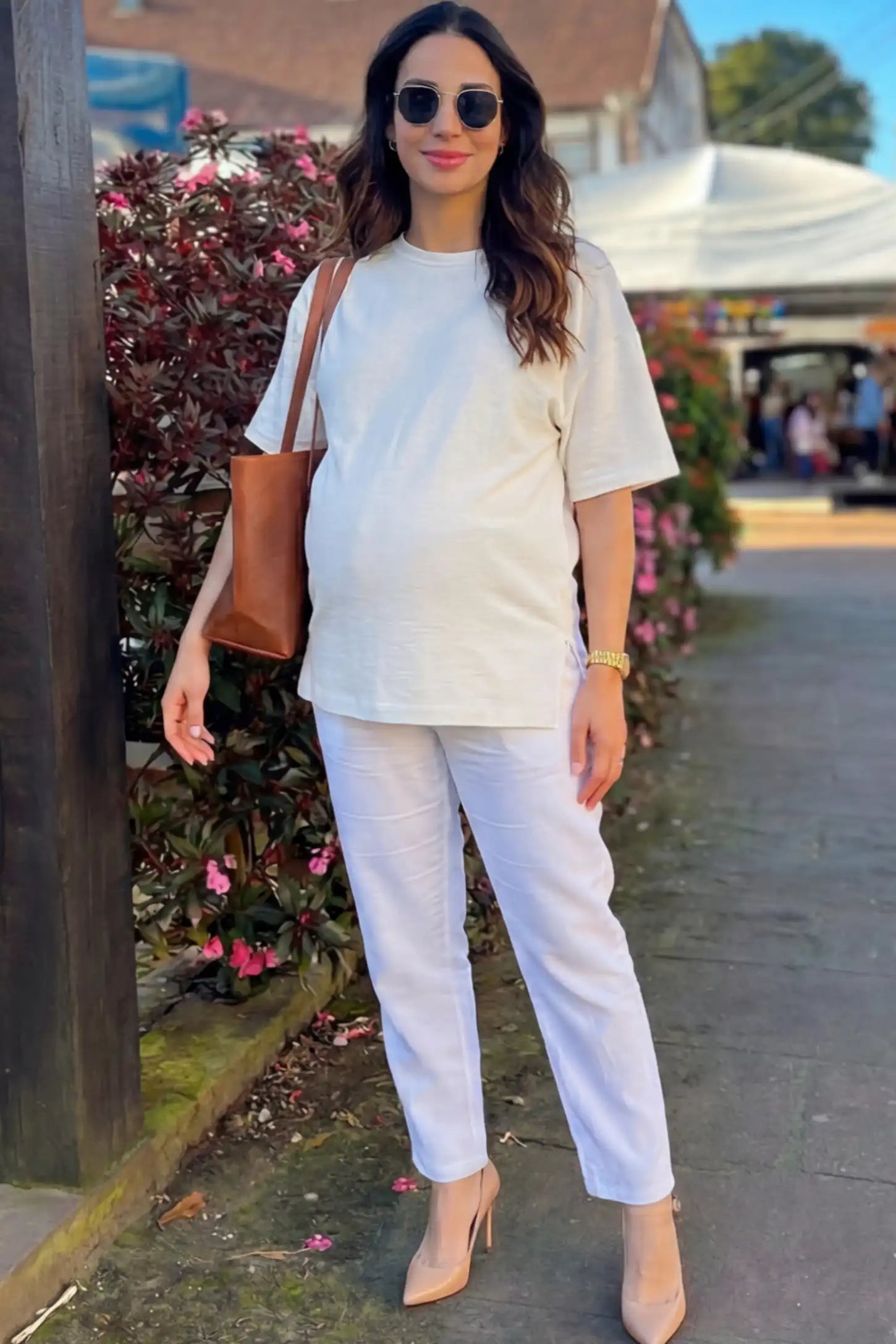 Oversized Short Sleeve Maternity T-Shirt Textured Oversized Short Sleeve Maternity T-Shirt in White featuring a side-slit hem and drop shoulders on a pregnant model.