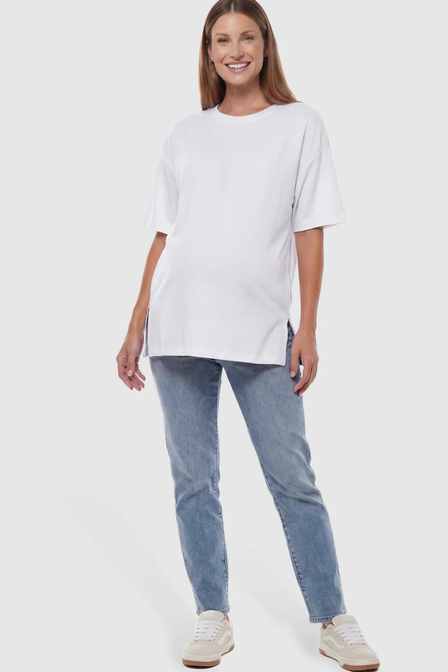 Oversized Short Sleeve Maternity T-Shirt Textured Oversized Short Sleeve Maternity T-Shirt in White featuring a side-slit hem and drop shoulders on a model.