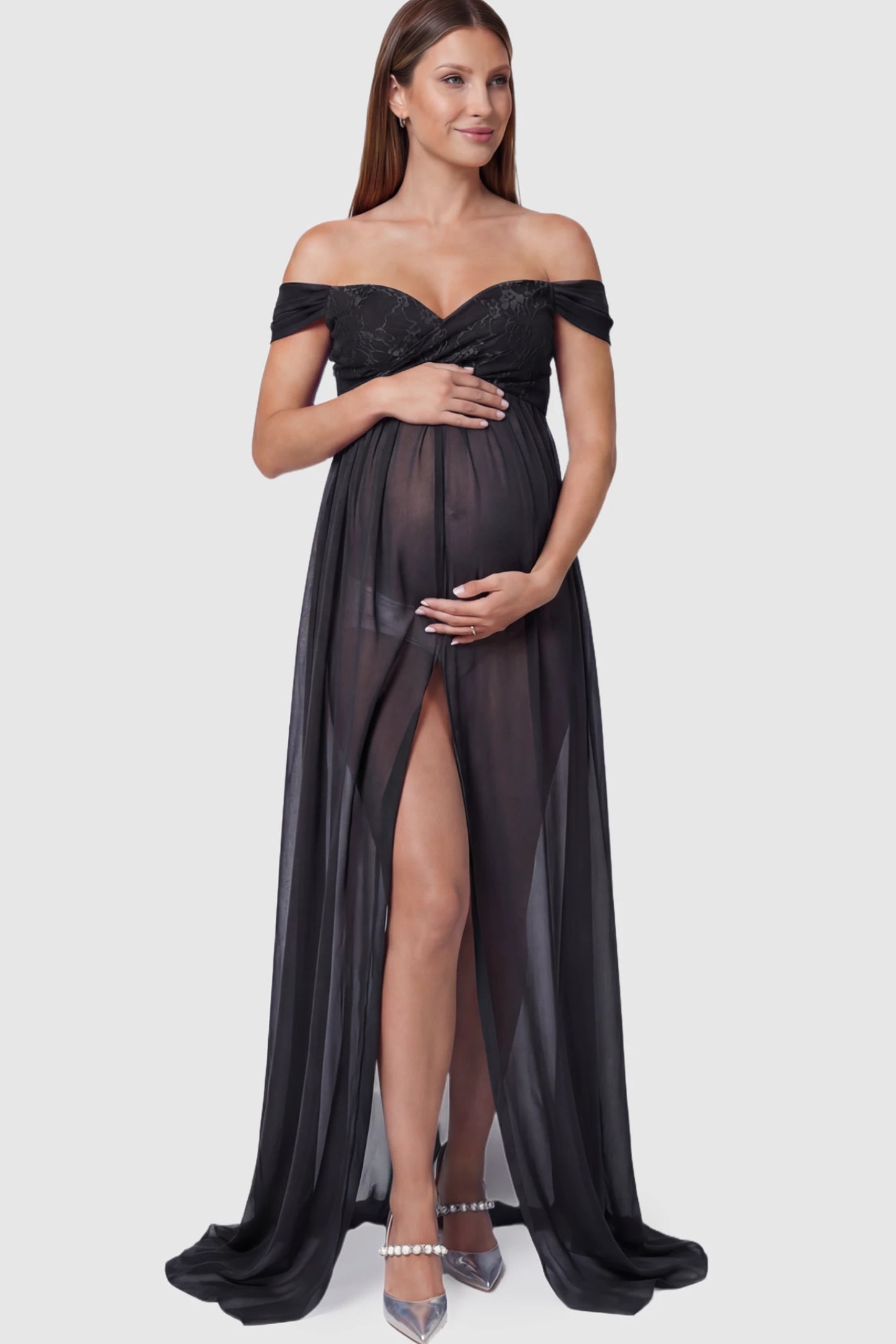 Lace Off Shoulder Slit Front Maternity Photoshoot Gown Lace Off Shoulder Slit Front Maternity Photoshoot Gown in black featuring a flowy chiffon opening on a pregnant model.