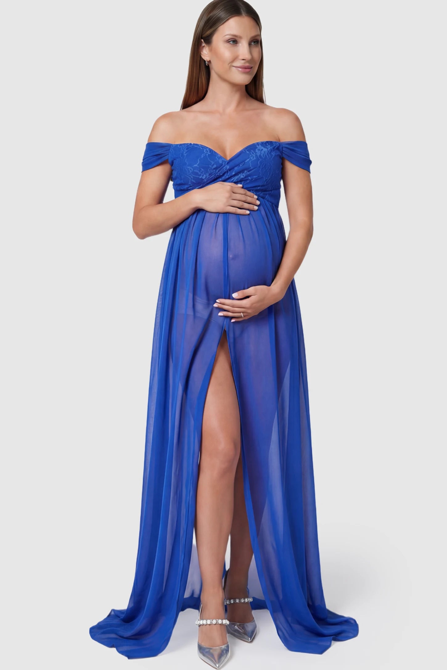 Lace Off Shoulder Slit Front Maternity Photoshoot Gown Lace Off Shoulder Slit Front Maternity Photoshoot Gown in blue featuring a flowy chiffon opening on a pregnant model.