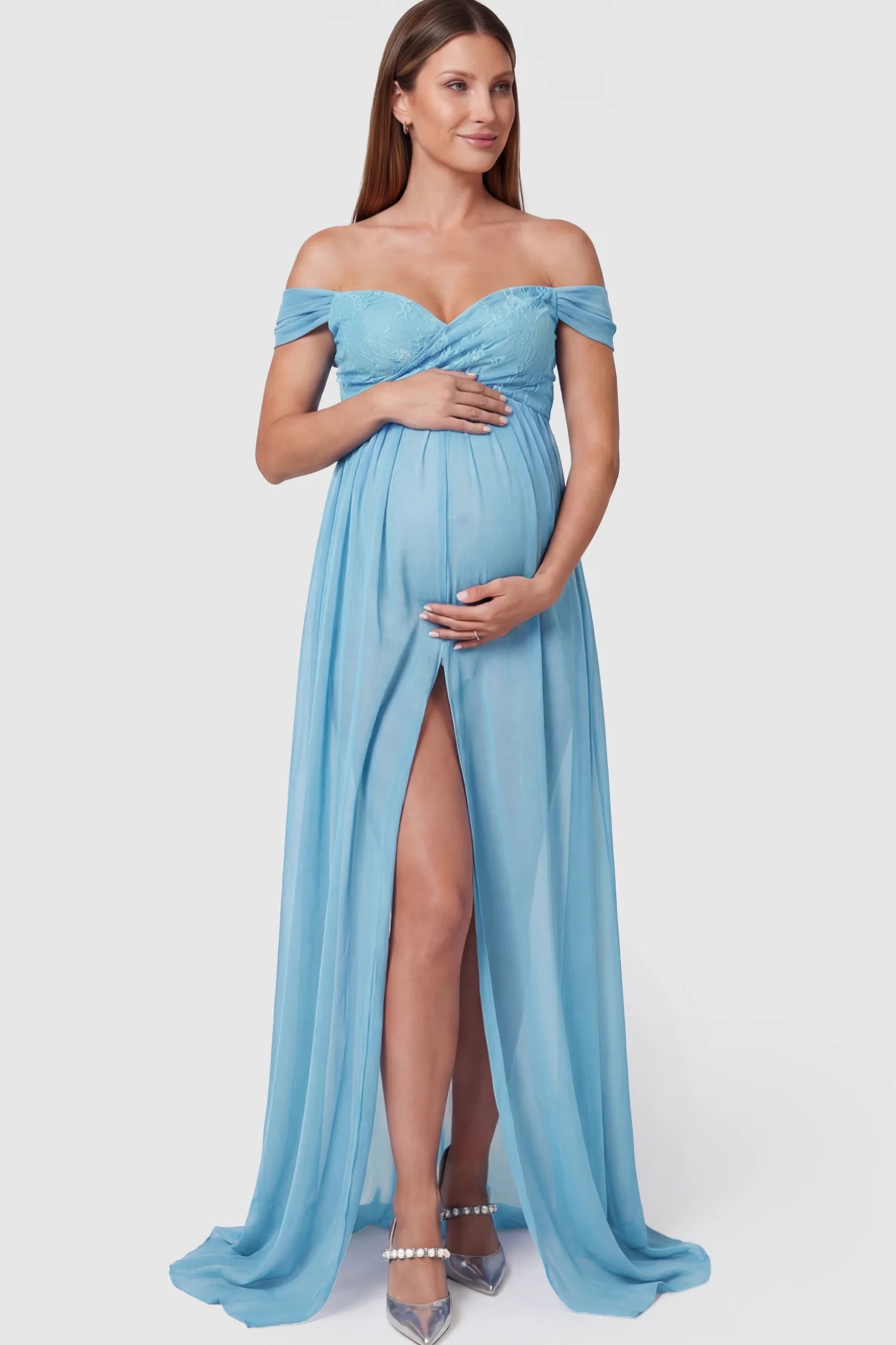 Lace Off Shoulder Slit Front Maternity Photoshoot Gown Lace Off Shoulder Slit Front Maternity Photoshoot Gown in light blue featuring a flowy chiffon opening on a pregnant model.