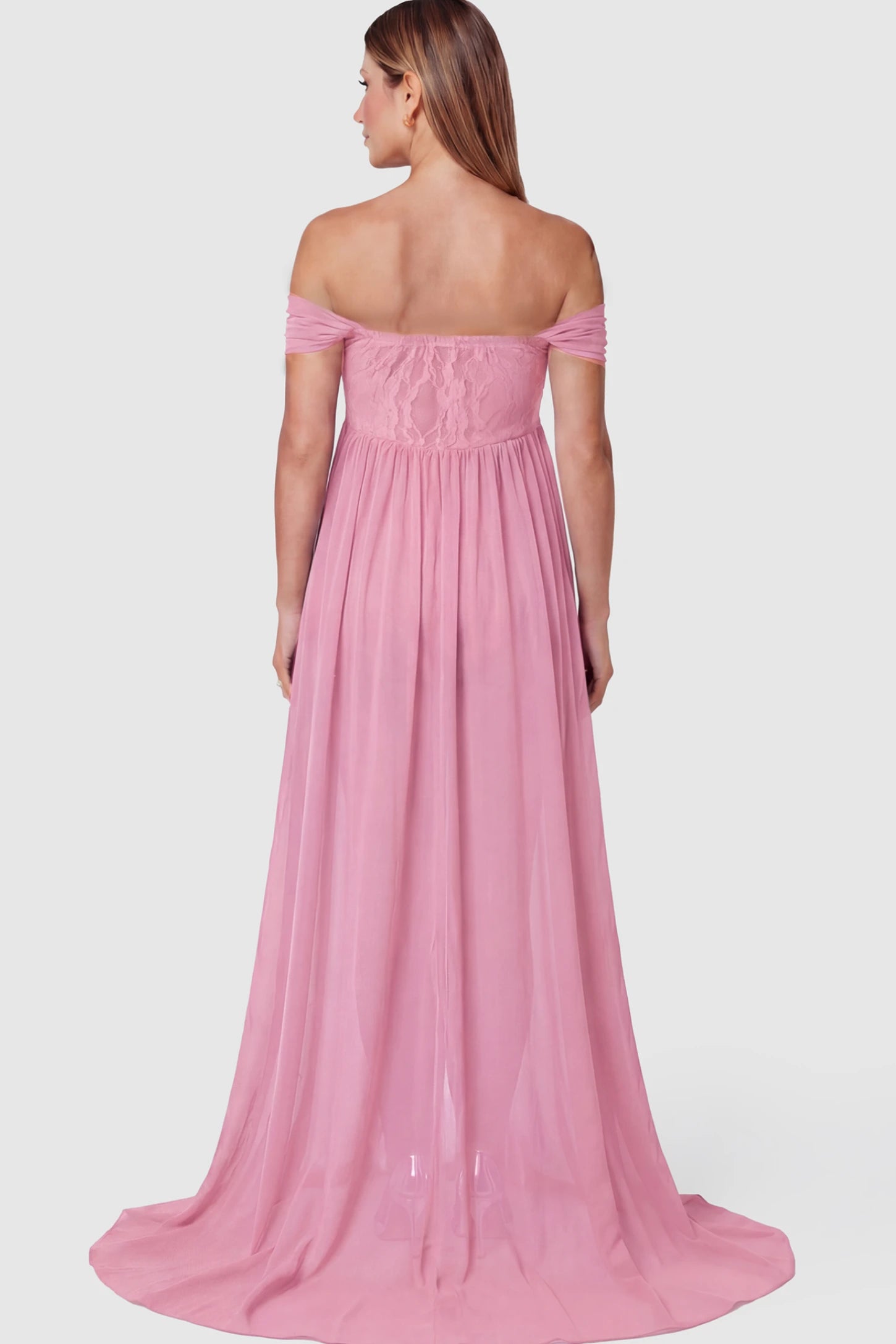 Lace Off Shoulder Slit Front Maternity Photoshoot Gown Lace Off Shoulder Slit Front Maternity Photoshoot Gown in Pink on a pregnant model.
