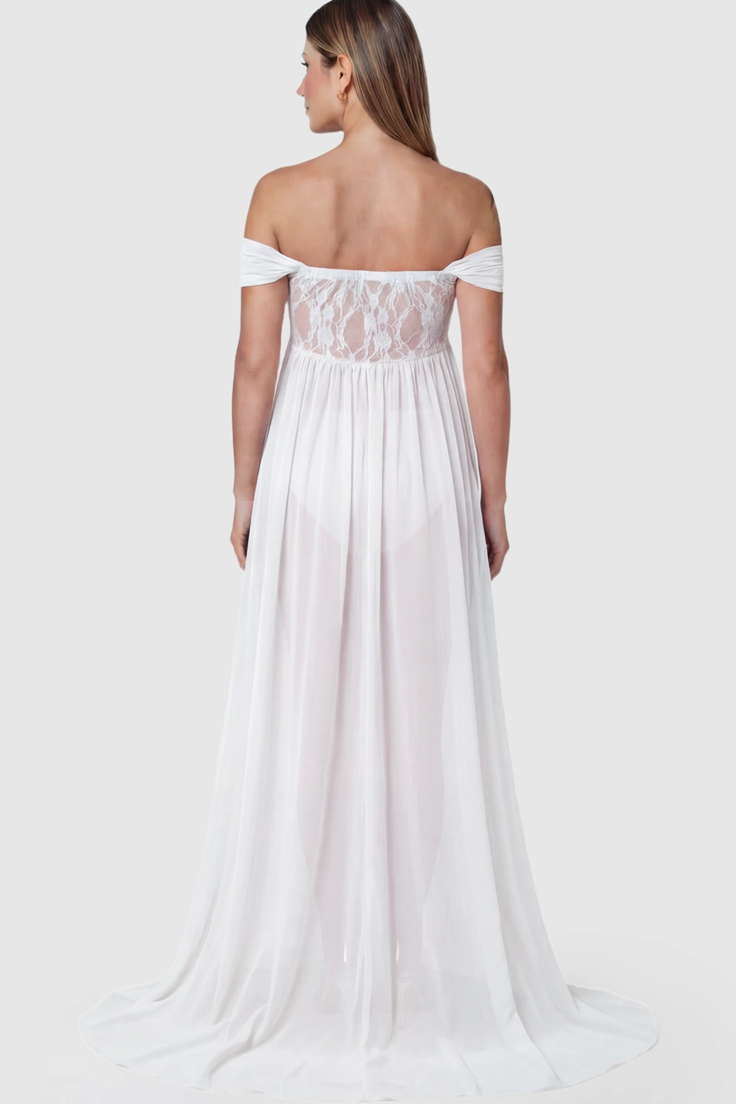 Lace Off Shoulder Slit Front Maternity Photoshoot Gown Lace Off Shoulder Slit Front Maternity Photoshoot Gown in white on a pregnant model.