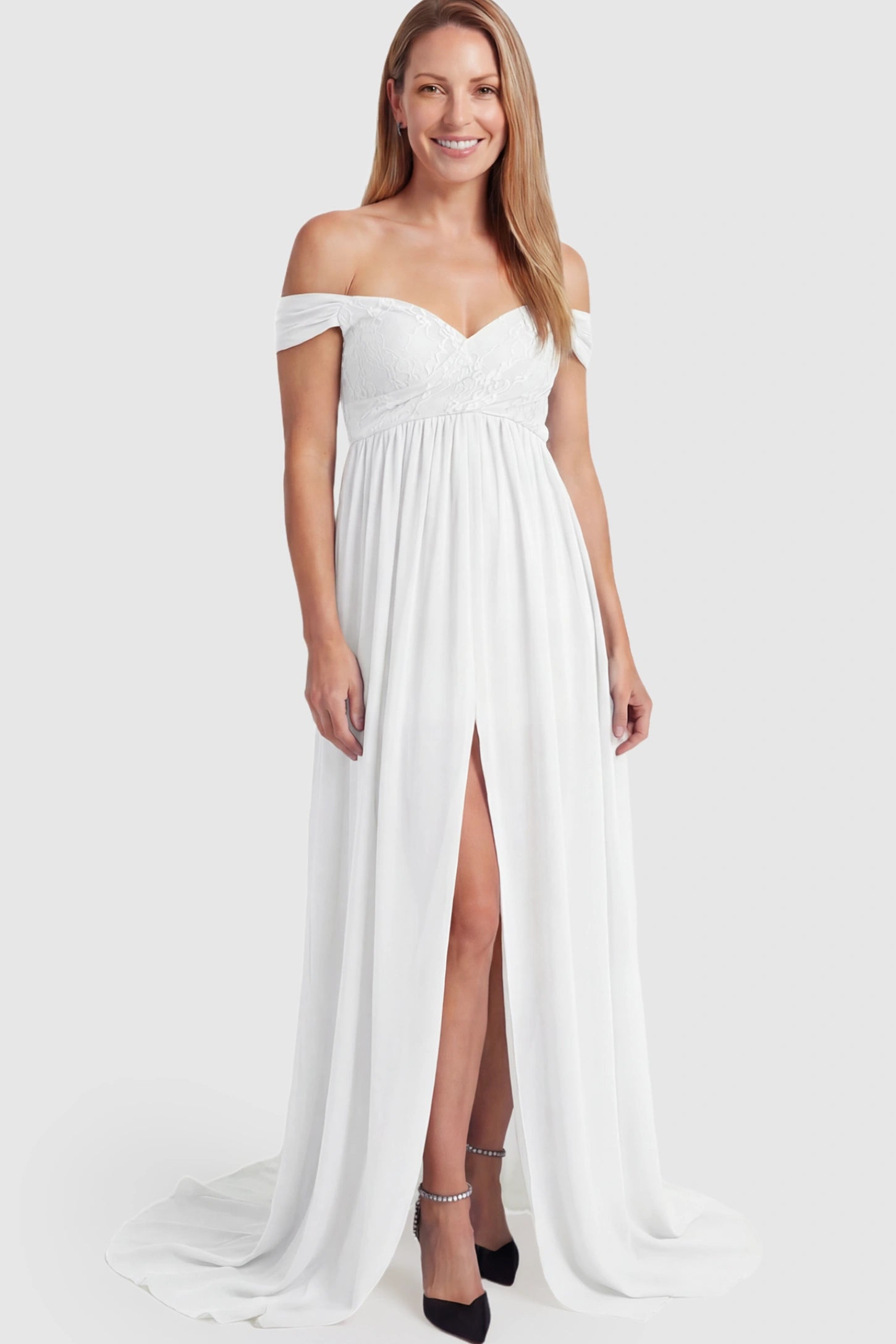 Lace Off Shoulder Slit Front Maternity Photoshoot Gown Lace Off Shoulder Slit Front Maternity Photoshoot Gown in white featuring a flowy chiffon opening on a postpartum model.