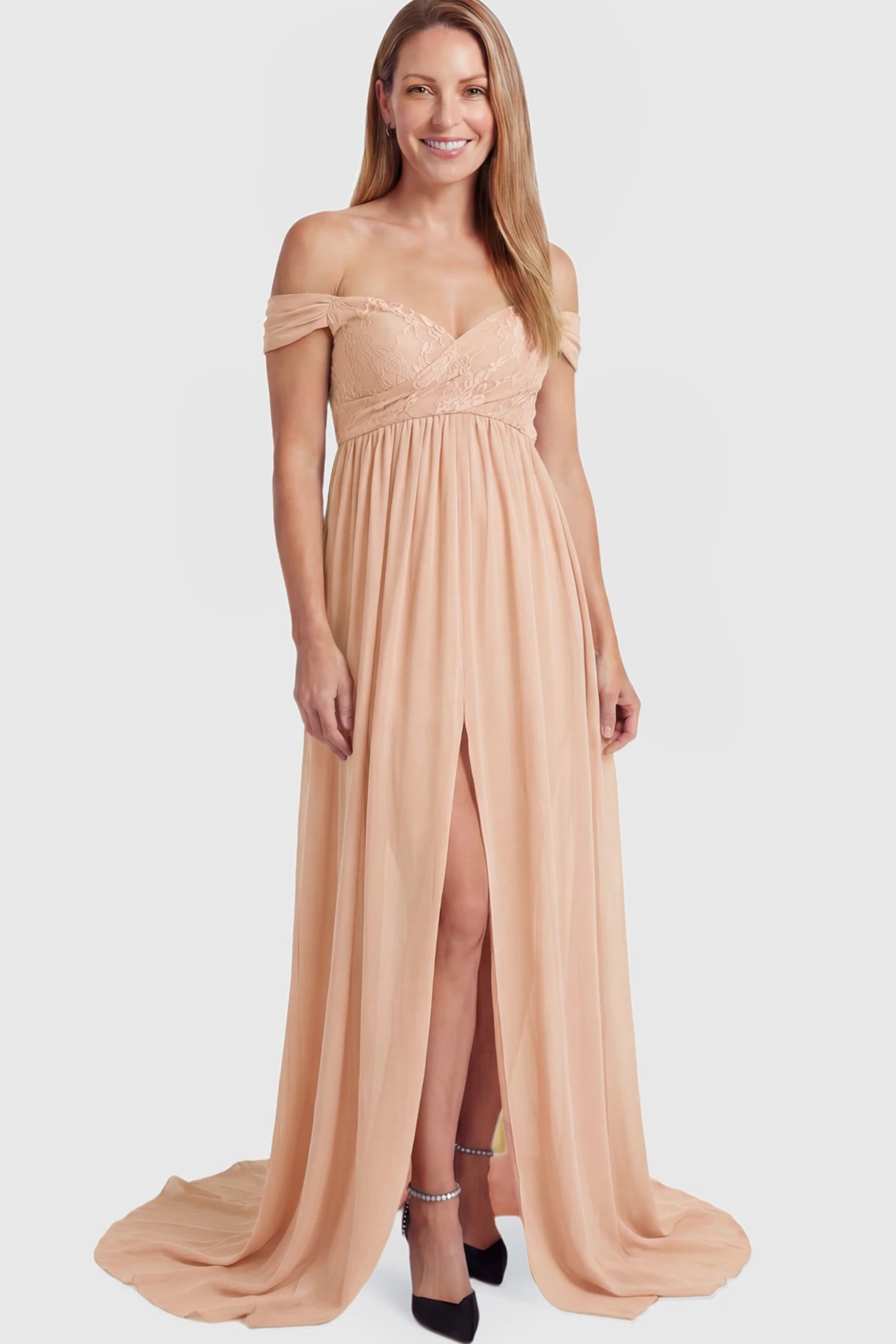Lace Off Shoulder Slit Front Maternity Photoshoot Gown Lace Off Shoulder Slit Front Maternity Photoshoot Gown in light peach featuring a flowy chiffon opening on a postpartum model.