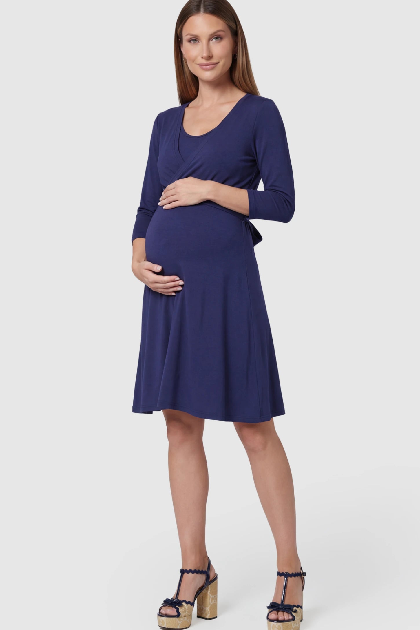 Layered Wrap Front Maternity Nursing Dress in Dark Blue featuring a double-layer nursing opening on a pregnant model.