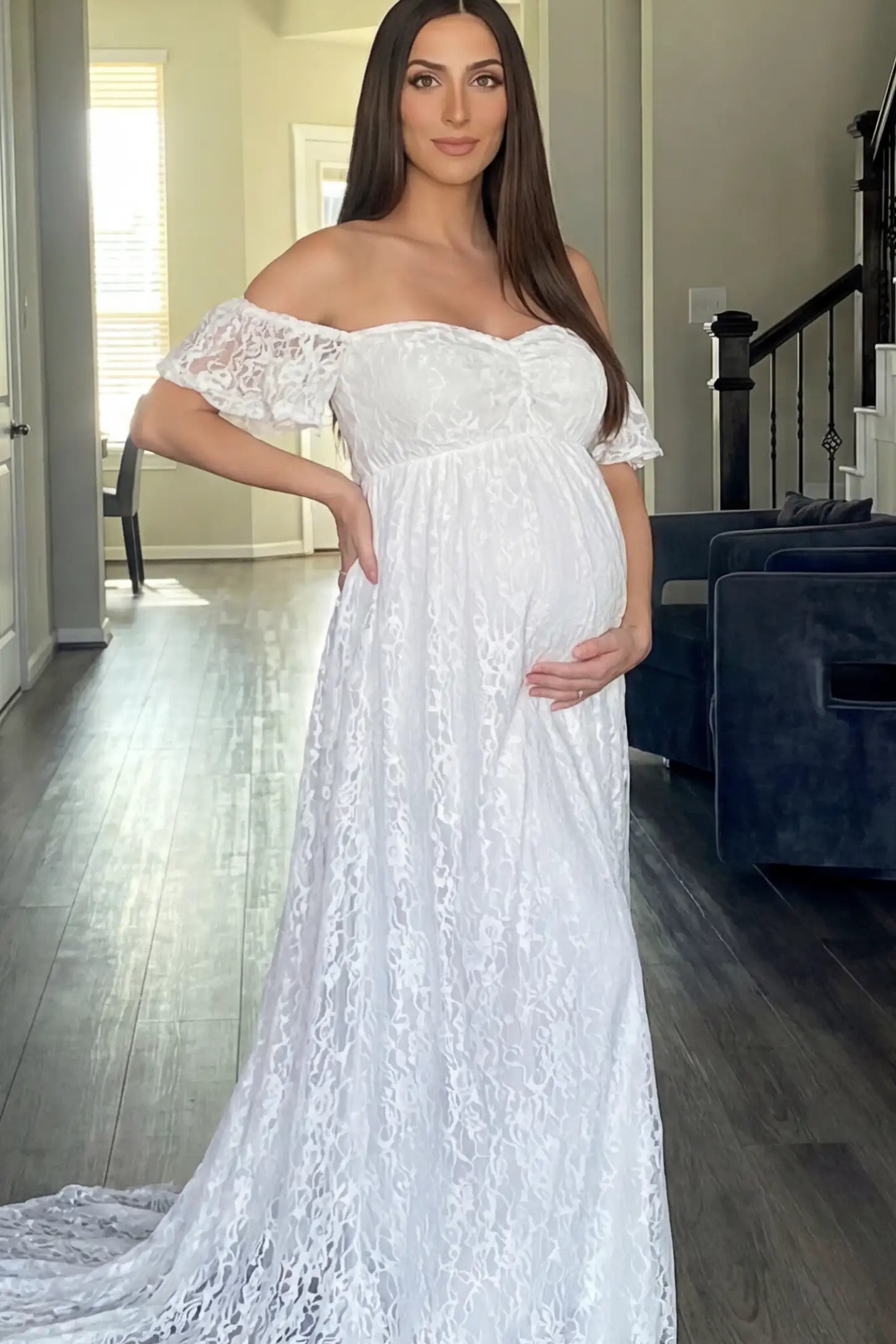 Floral Lace Off Shoulder Maternity Maxi Dress Floral Lace Off The Shoulder Maternity Maxi Dress featuring a ruched bust in White on a pregnant model.