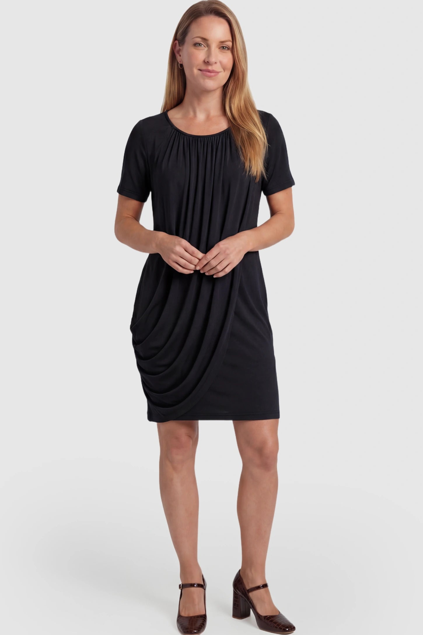 Draped Ruched Wrap Front Maternity Nursing Dress Draped Ruched Wrap Front Maternity Nursing Dress in Black with short sleeves on a postpartum model.