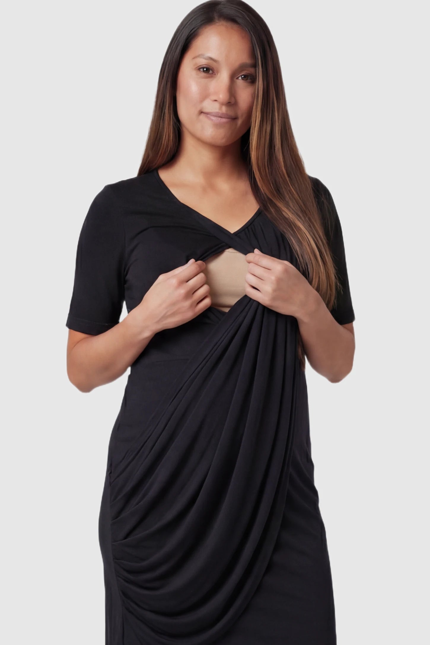 Draped Ruched Wrap Front Maternity Nursing Dress Draped Ruched Wrap Front Maternity Nursing Dress in Black featuring nursing access on a pregnant model.