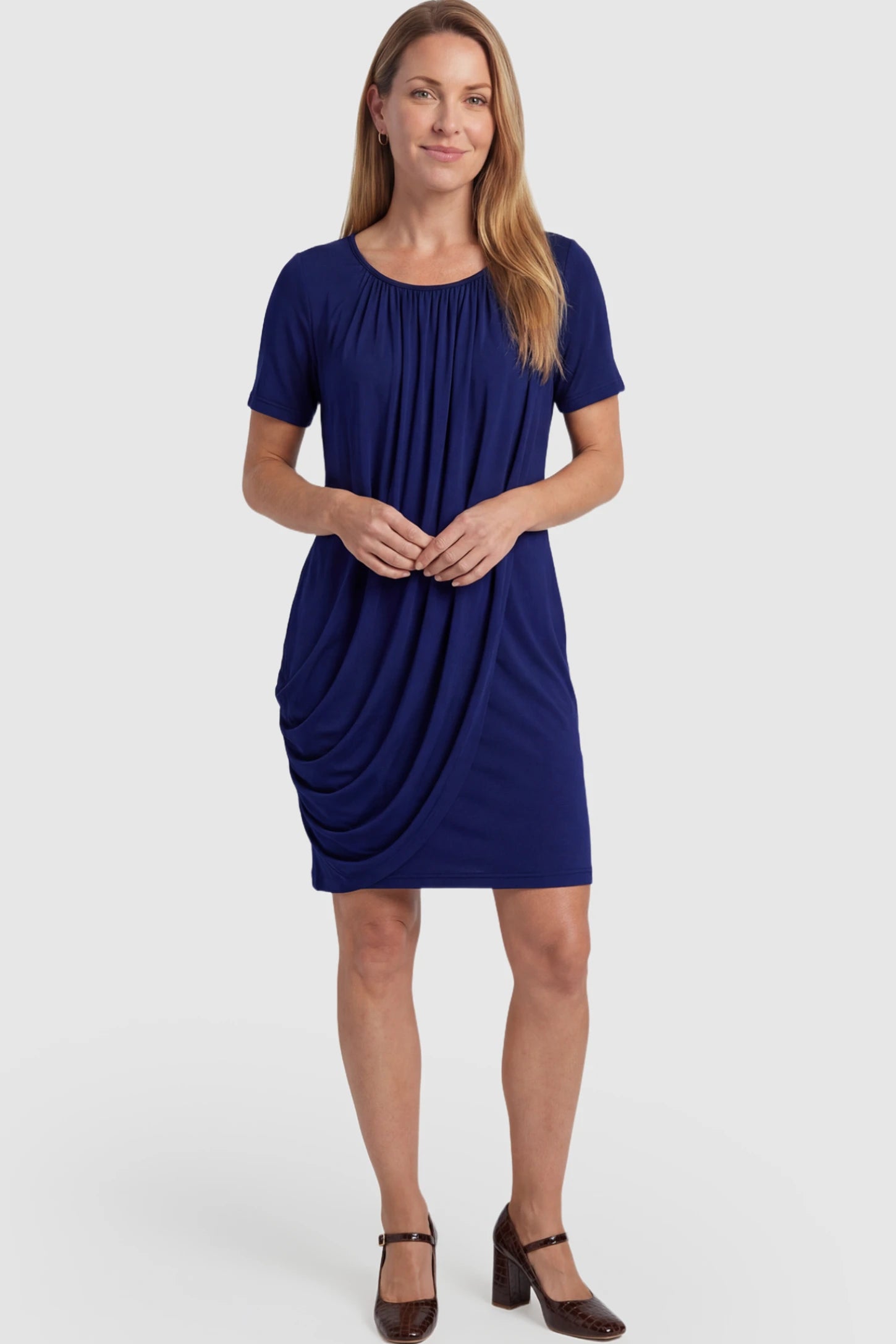 Draped Ruched Wrap Front Maternity Nursing Dress Draped Ruched Wrap Front Maternity Nursing Dress in Dark Blue with short sleeves on a postpartum model.