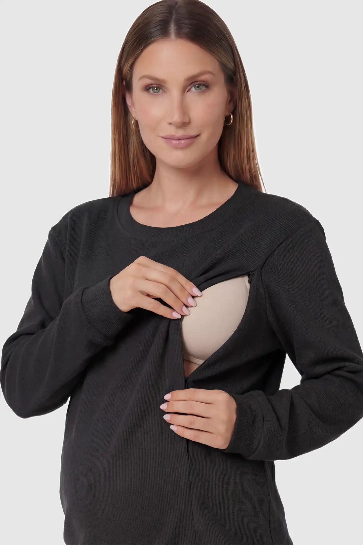 Waffle Knit Long Sleeve Maternity Pullover Sweatshirt Waffle Knit Long Sleeve Maternity Pullover Sweatshirt in Black featuring hidden nursing zippers on a pregnant model.