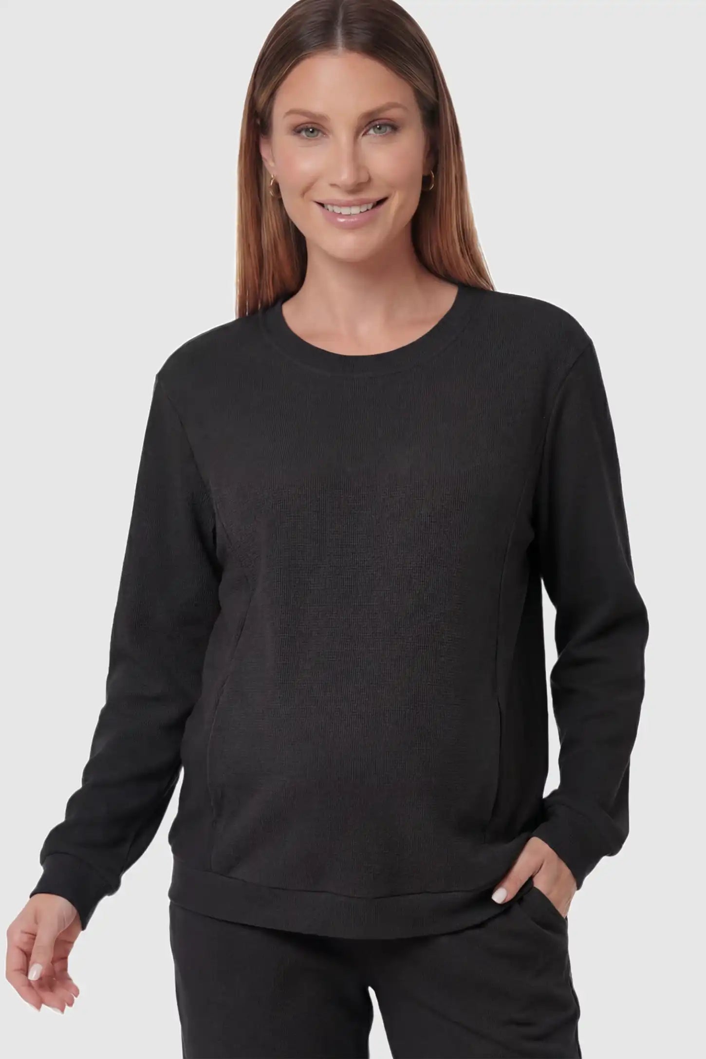 Waffle Knit Long Sleeve Maternity Pullover Sweatshirt in Black featuring hidden nursing zippers on a pregnant model.