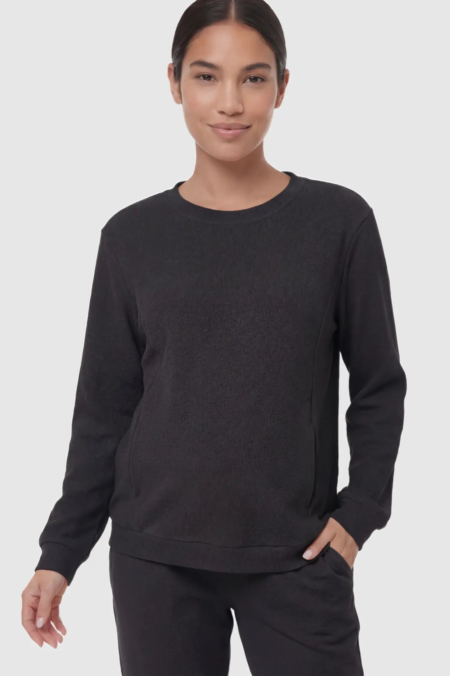 Waffle Knit Long Sleeve Maternity Pullover Sweatshirt Waffle Knit Long Sleeve Maternity Pullover Sweatshirt in Black featuring hidden nursing zippers on a non pregnant model.