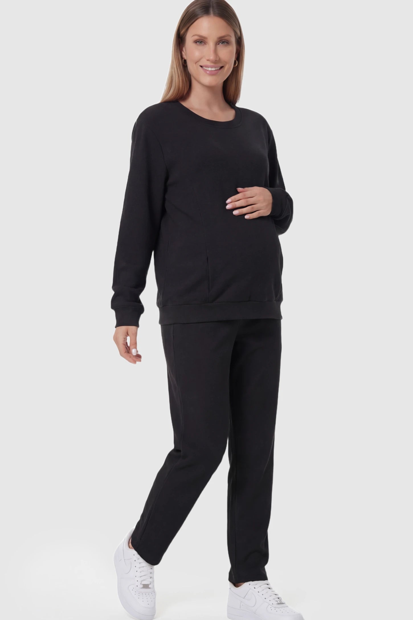 Waffle Knit Long Sleeve Maternity Pullover Sweatshirt Waffle Knit Long Sleeve Maternity Pullover Sweatshirt in Black featuring hidden nursing zippers on a pregnant model.