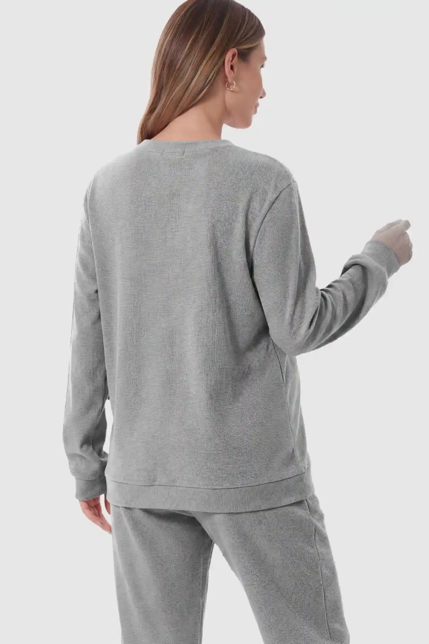 Waffle Knit Long Sleeve Maternity Pullover Sweatshirt Waffle Knit Long Sleeve Maternity Pullover Sweatshirt in Gray on a pregnant model.