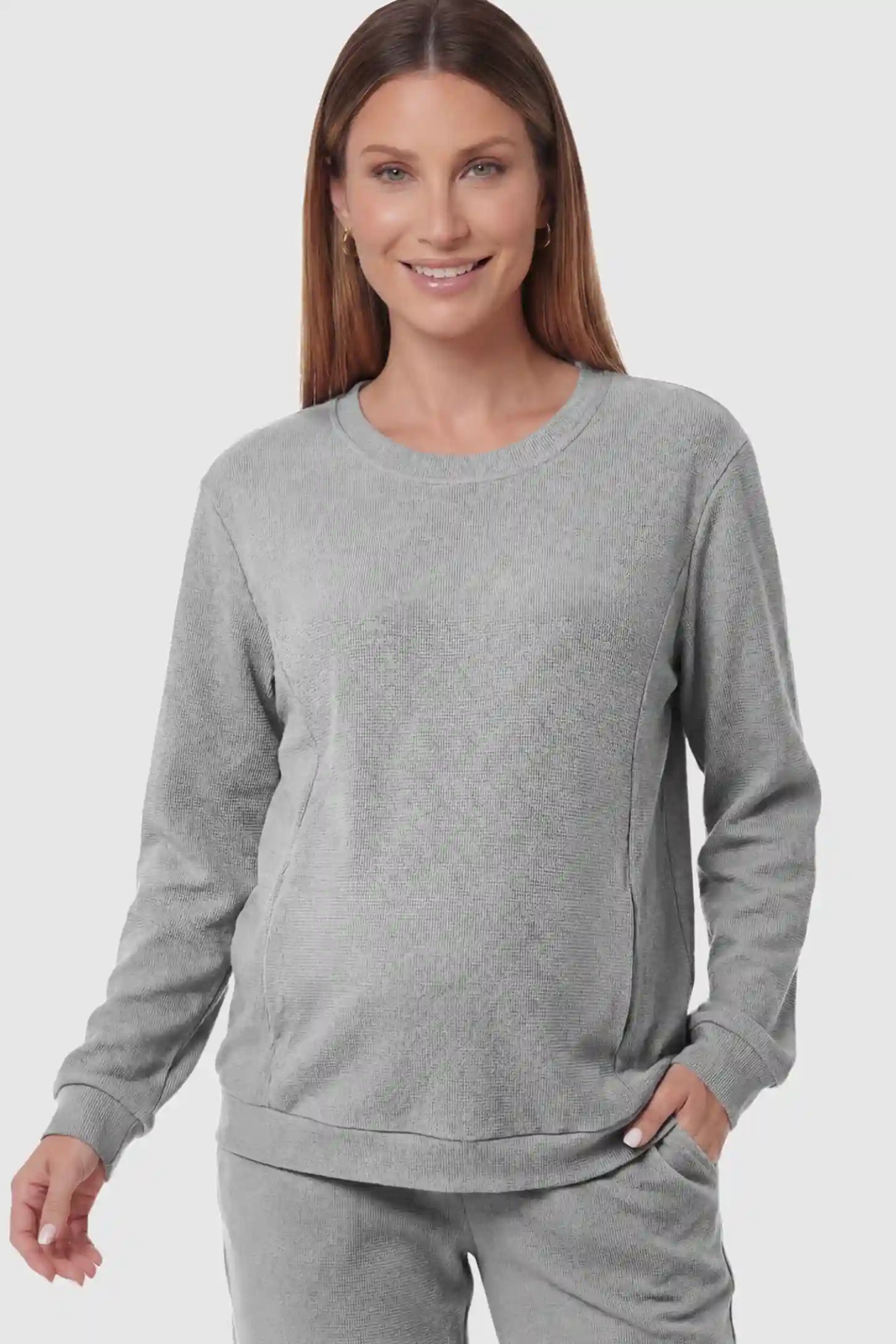 Waffle Knit Long Sleeve Maternity Pullover Sweatshirt Waffle Knit Long Sleeve Maternity Pullover Sweatshirt in Gray featuring hidden nursing zippers on a pregnant model.