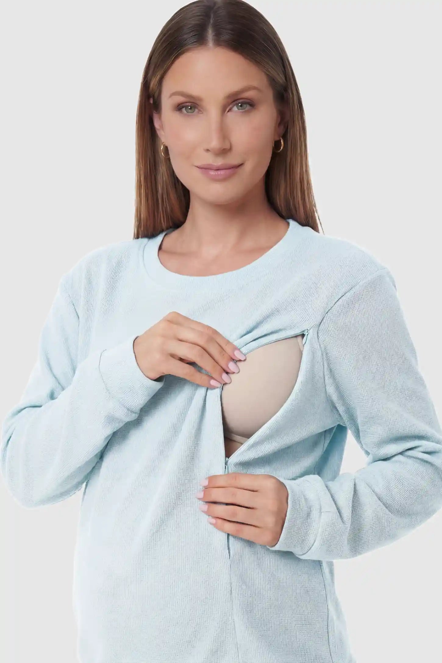 Waffle Knit Long Sleeve Maternity Pullover Sweatshirt Waffle Knit Long Sleeve Maternity Pullover Sweatshirt in Light Blue featuring hidden nursing zippers on a pregnant model.