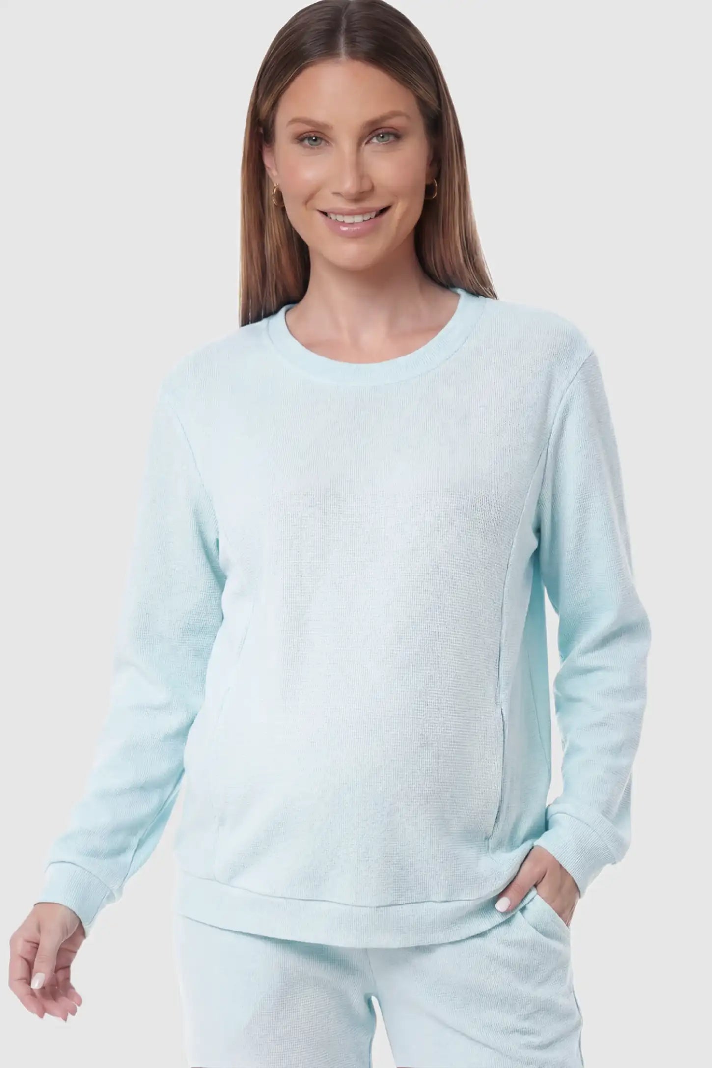 Waffle Knit Long Sleeve Maternity Pullover Sweatshirt Waffle Knit Long Sleeve Maternity Pullover Sweatshirt in Light Blue featuring hidden nursing zippers on a pregnant model.