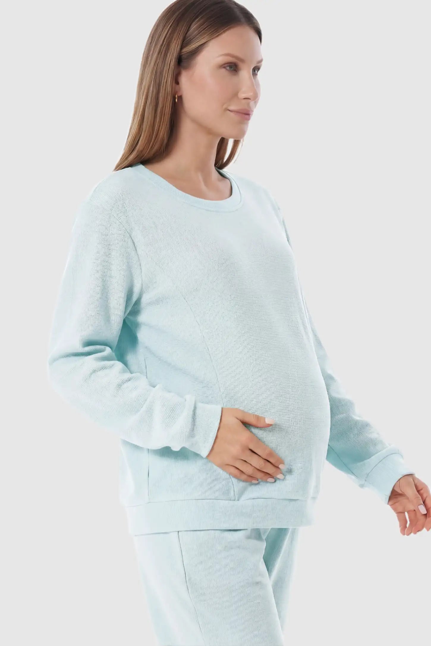 Waffle Knit Long Sleeve Maternity Pullover Sweatshirt Waffle Knit Long Sleeve Maternity Pullover Sweatshirt in Light Blue featuring hidden nursing zippers on a pregnant model.