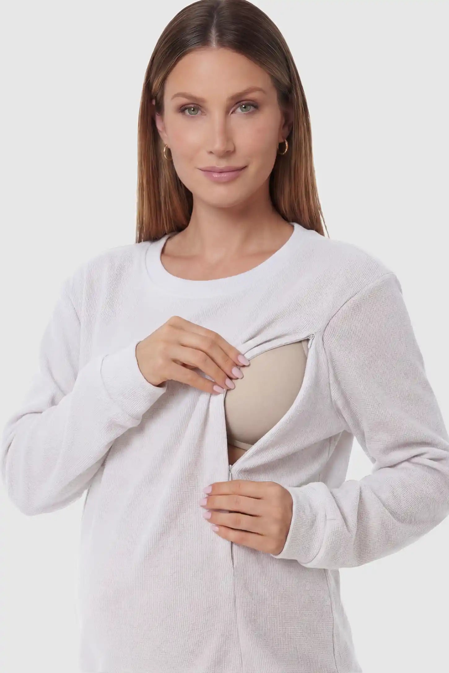 Waffle Knit Long Sleeve Maternity Pullover Sweatshirt Waffle Knit Long Sleeve Maternity Pullover Sweatshirt in White featuring hidden nursing zippers on a pregnant model.