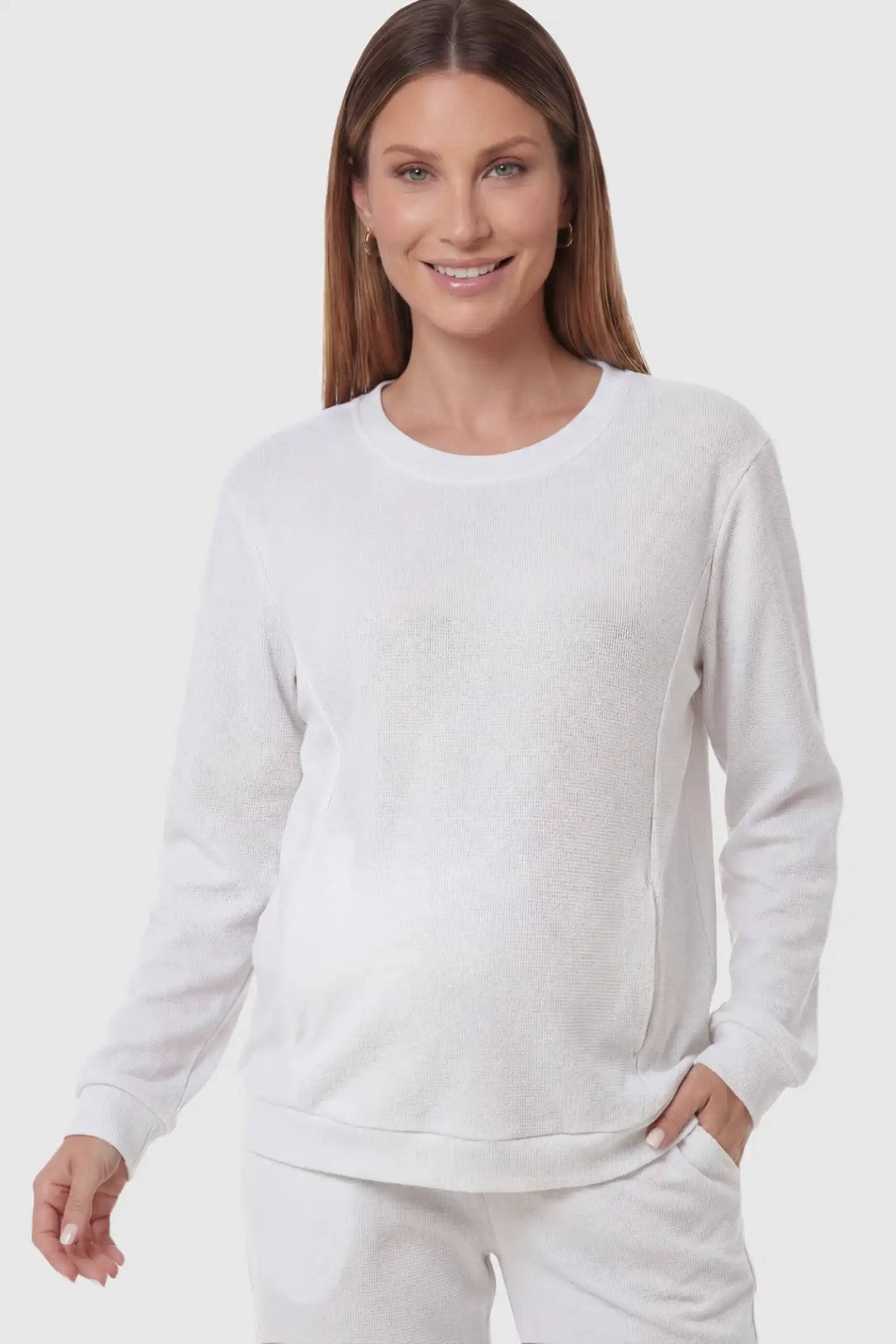 Waffle Knit Long Sleeve Maternity Pullover Sweatshirt Waffle Knit Long Sleeve Maternity Pullover Sweatshirt in White featuring hidden nursing zippers on a pregnant model.
