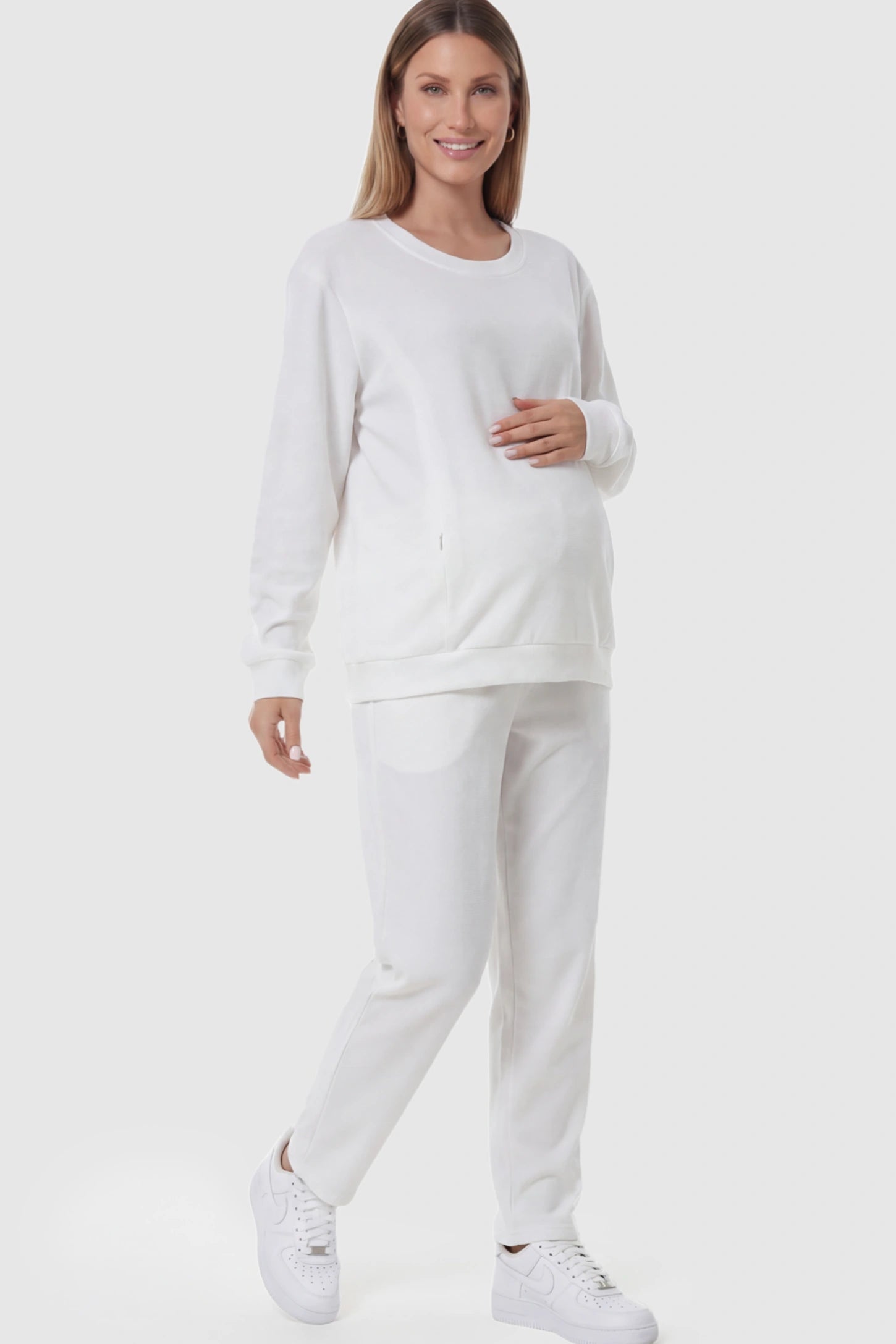 Waffle Knit Long Sleeve Maternity Pullover Sweatshirt Waffle Knit Long Sleeve Maternity Pullover Sweatshirt in White featuring hidden nursing zippers on a pregnant model.