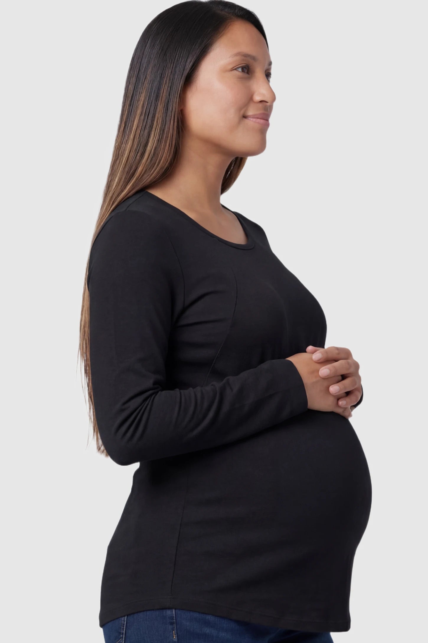 Solid Crew Neck Long Sleeve Maternity & Nursing Top Solid Crew Neck Long Sleeve Maternity & Nursing Top in Black featuring a discreet lift-up breastfeeding access on a model.