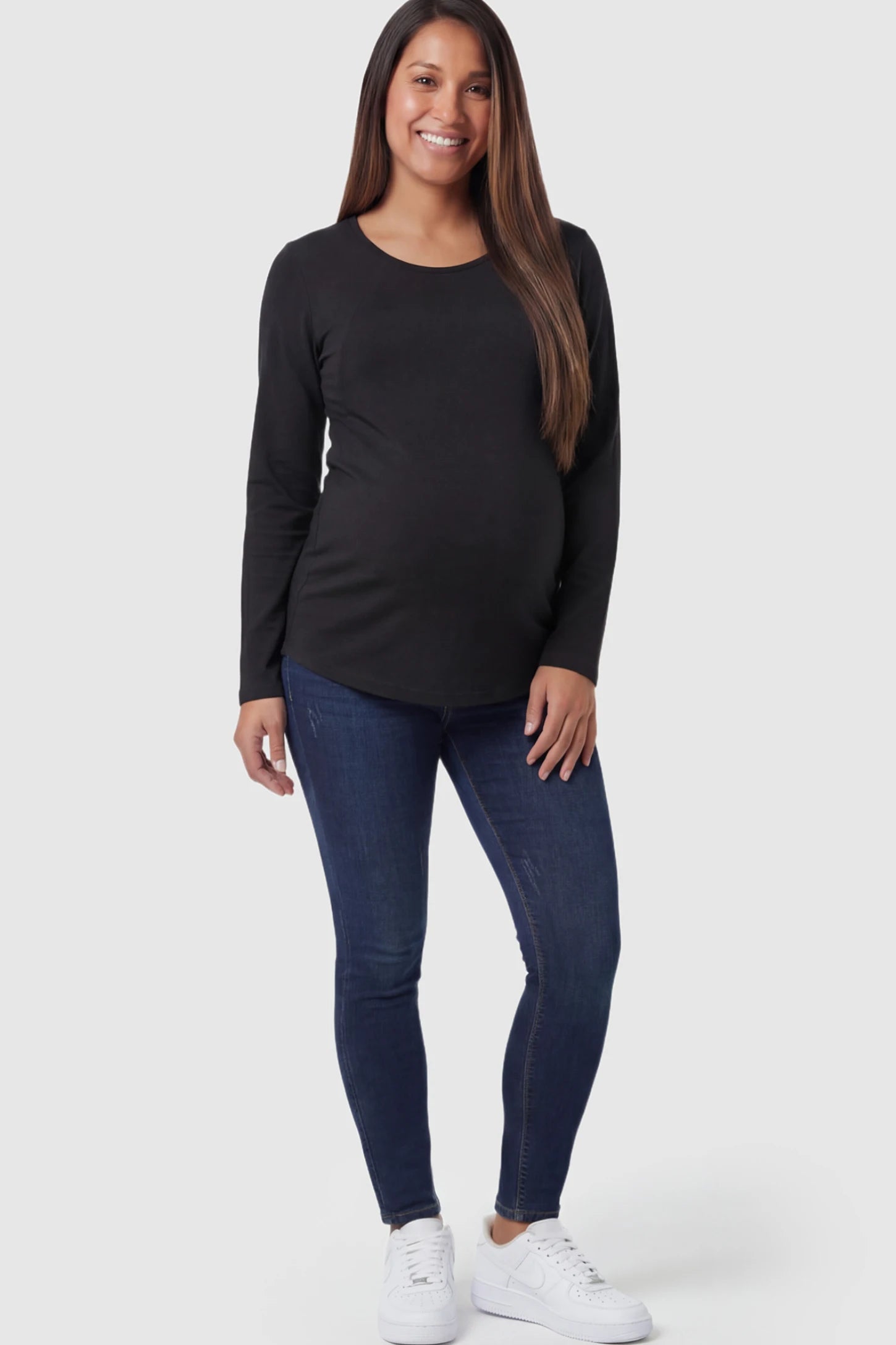 Solid Crew Neck Long Sleeve Maternity & Nursing Top Solid Crew Neck Long Sleeve Maternity & Nursing Top in Black featuring a discreet lift-up breastfeeding access on a model.