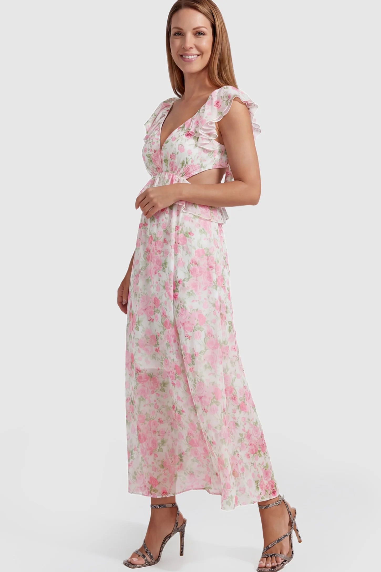 Floral V-Neck Ruffle Backless Maternity Maxi Dress Floral Print V-Neck Ruffle Backless Maxi Maternity Dress with a peplum waist and flutter sleeves on a postpartum model.