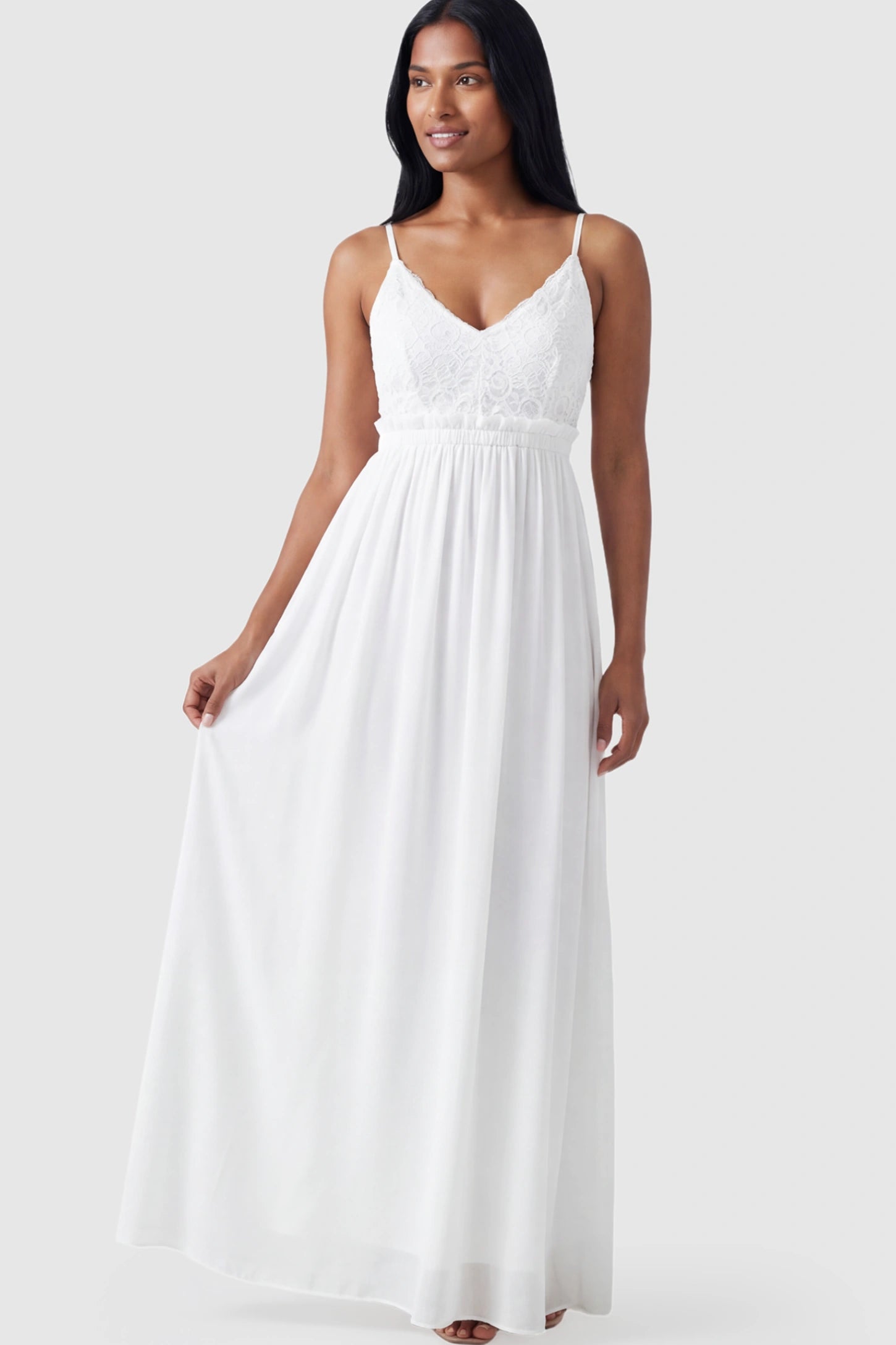 Lace Bodice V-Neck Maternity Maxi Dress Lace Bodice V-Neck Maternity Maxi Dress in White featuring a floral lace overlay and spaghetti straps on a postpartum model.
