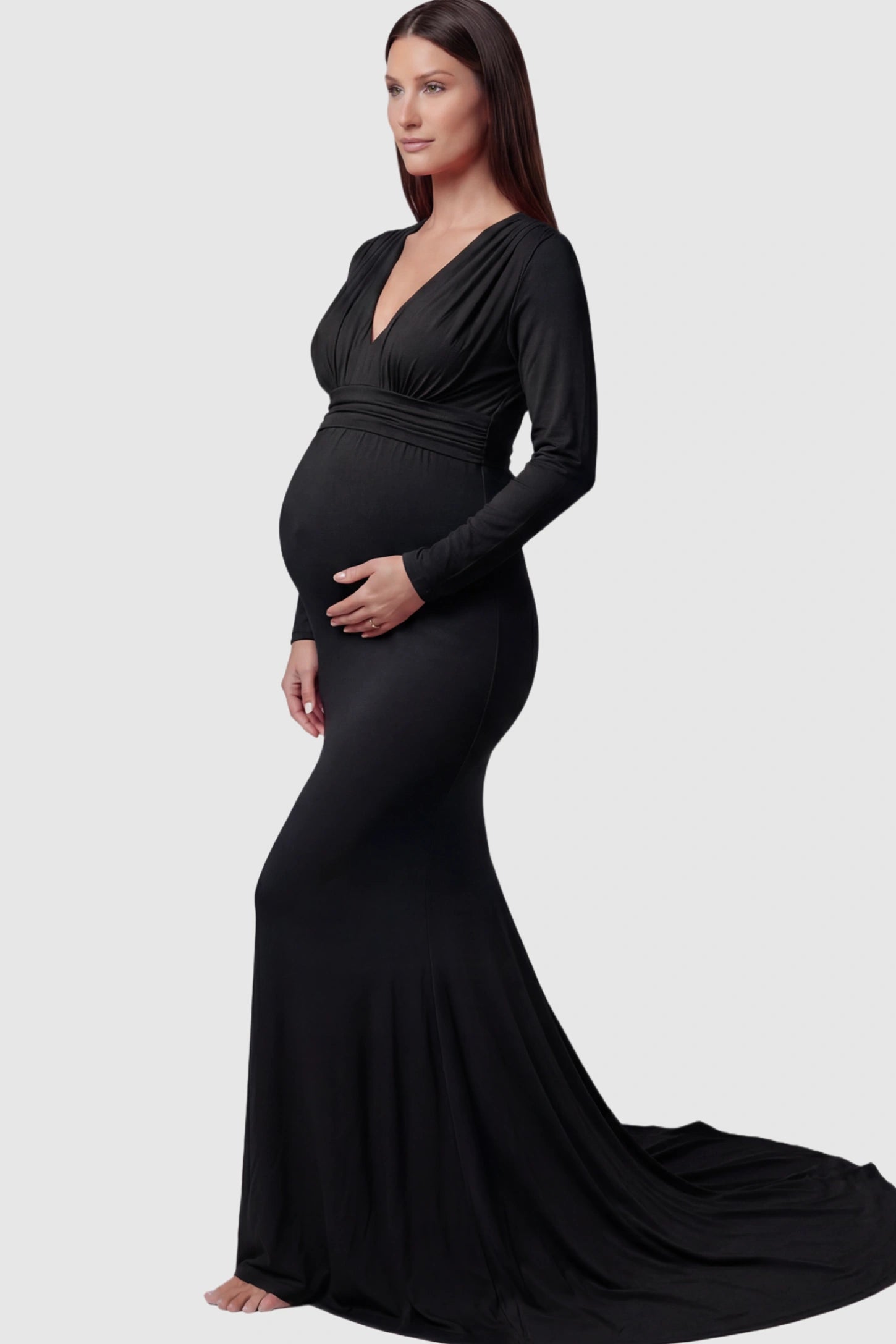 Pure Cotton V-Neck Long Sleeve Maternity Photoshoot Gown Pure Cotton V-Neck Long Sleeve Maternity Photoshoot Gown in Black featuring a floor-pooling train on a pregnant model.