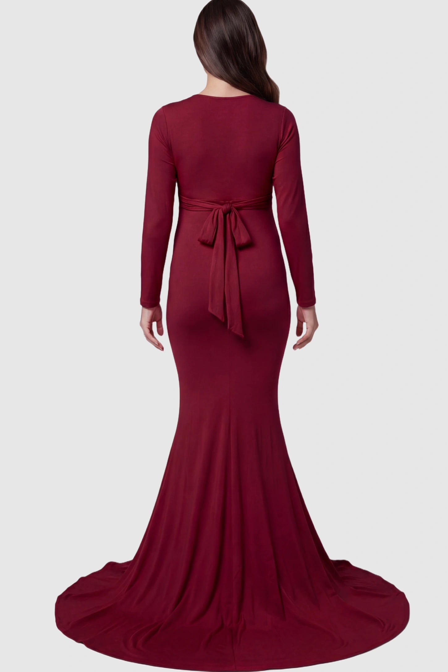 Pure Cotton V-Neck Long Sleeve Maternity Photoshoot Gown Pure Cotton V-Neck Long Sleeve Maternity Photoshoot Gown in Burgundy featuring a floor-pooling train on a pregnant model.
