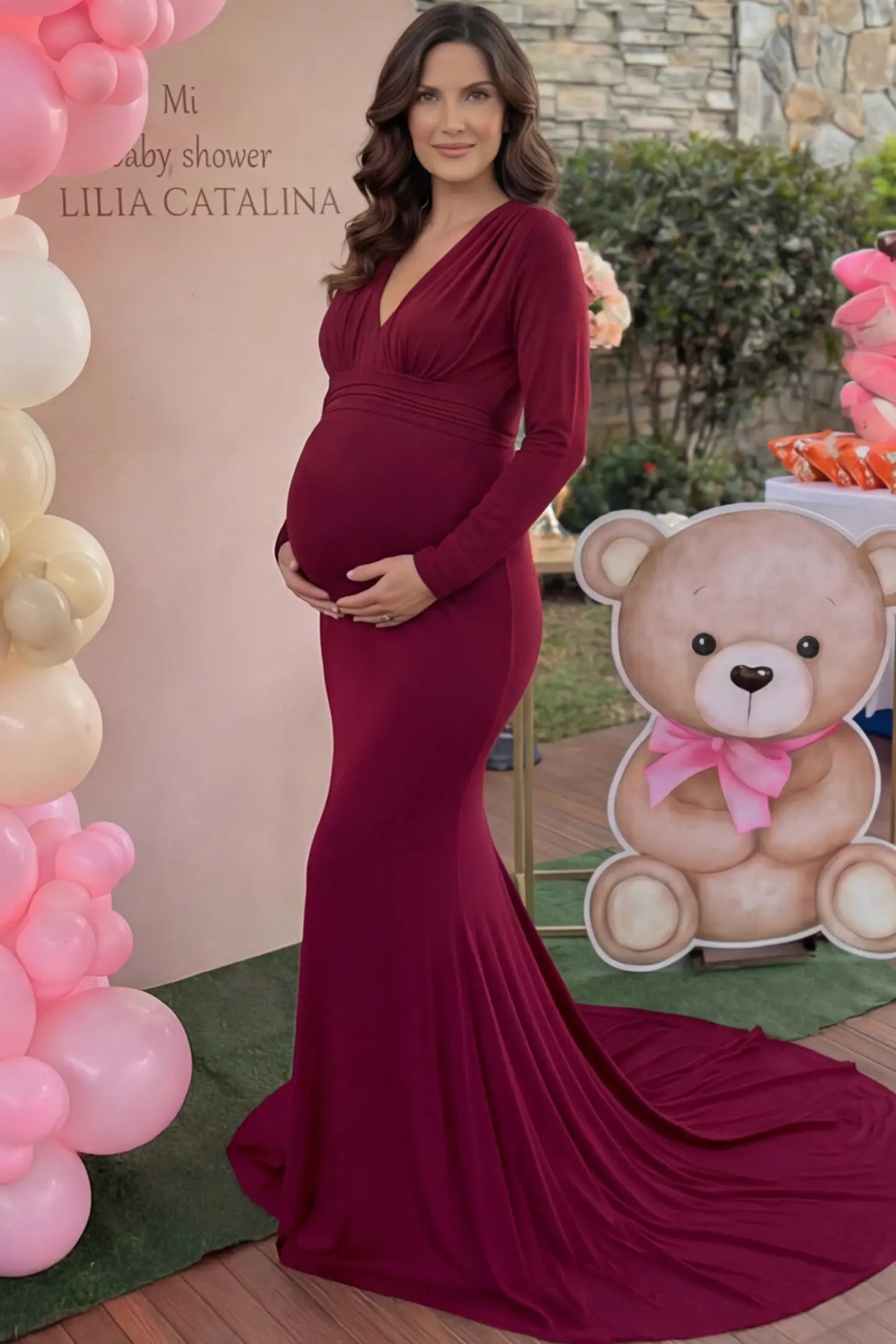 Pure Cotton V-Neck Long Sleeve Maternity Photoshoot Gown Pure Cotton V-Neck Long Sleeve Maternity Photoshoot Gown in Burgundy featuring a floor-pooling train on a pregnant model.