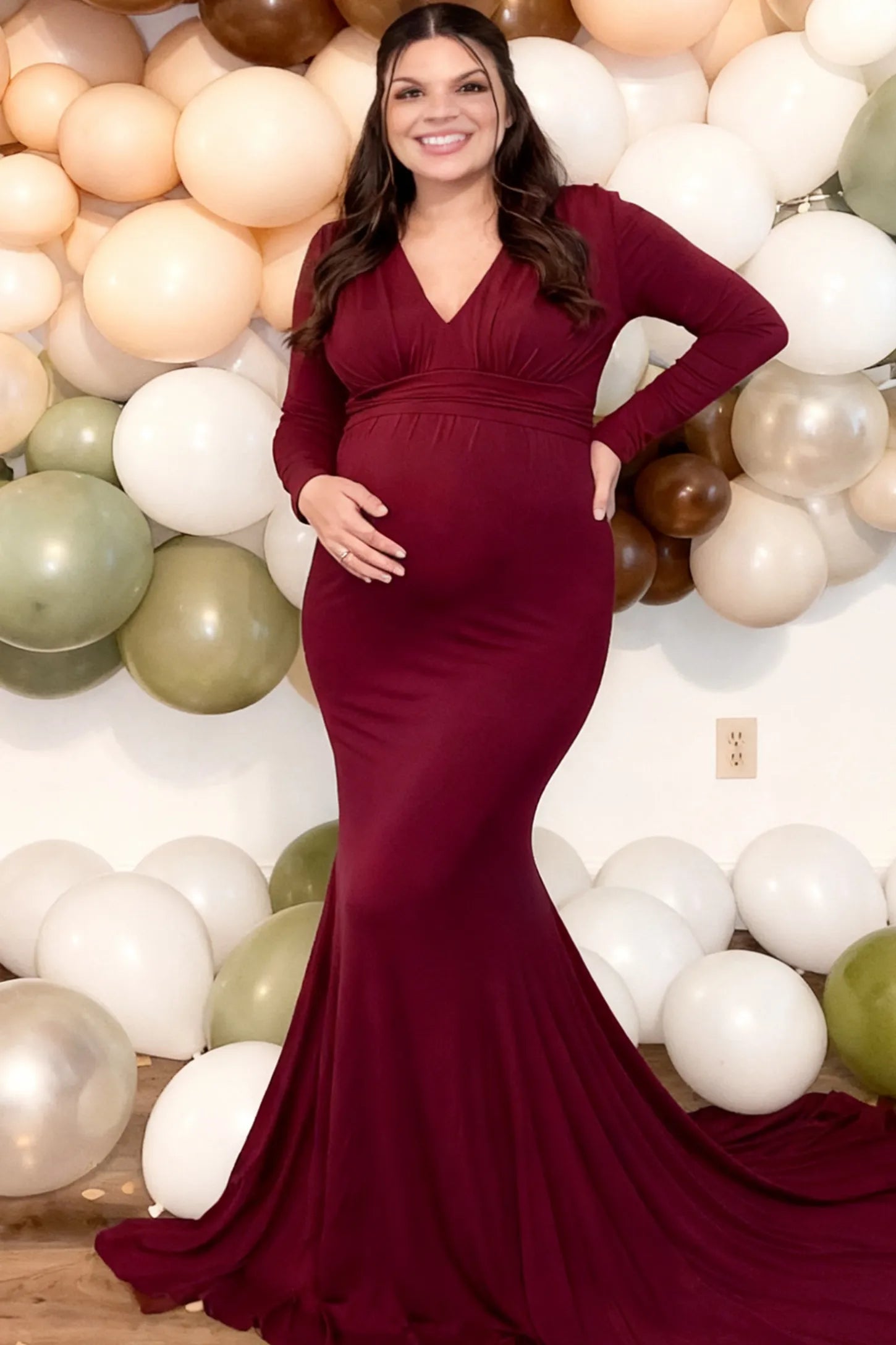 Pure Cotton V-Neck Long Sleeve Maternity Photoshoot Gown Pure Cotton V-Neck Long Sleeve Maternity Photoshoot Gown in Burgundy featuring a floor-pooling train on a pregnant model.
