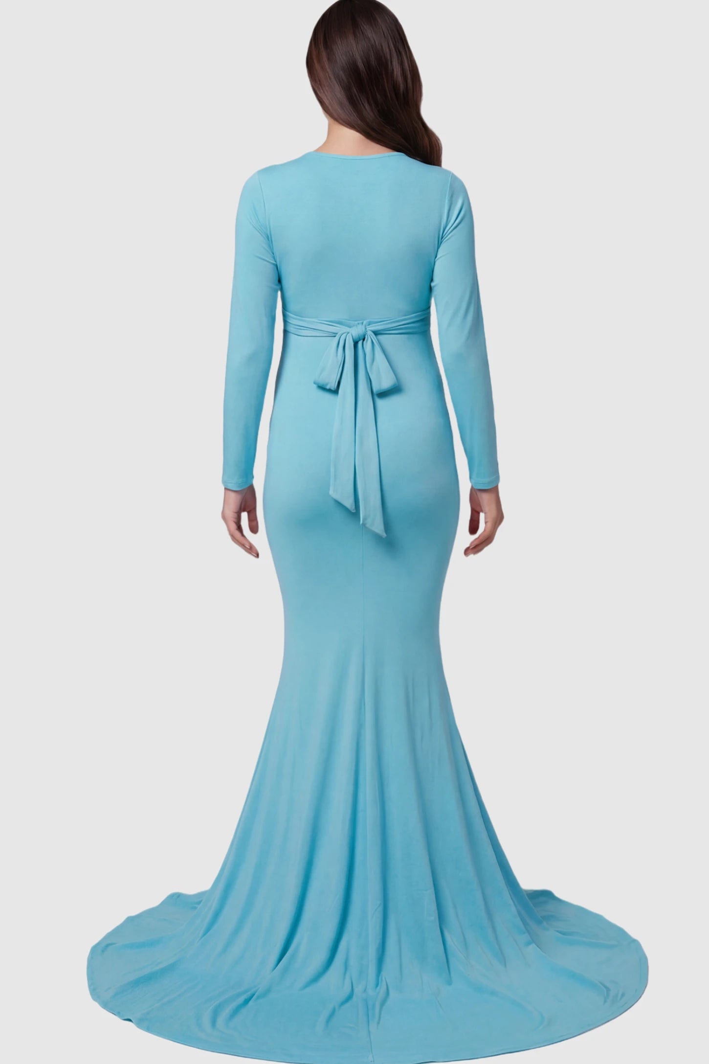 Pure Cotton V-Neck Long Sleeve Maternity Photoshoot Gown Pure Cotton V-Neck Long Sleeve Maternity Photoshoot Gown in Light Blue featuring a floor-pooling train on a pregnant model.