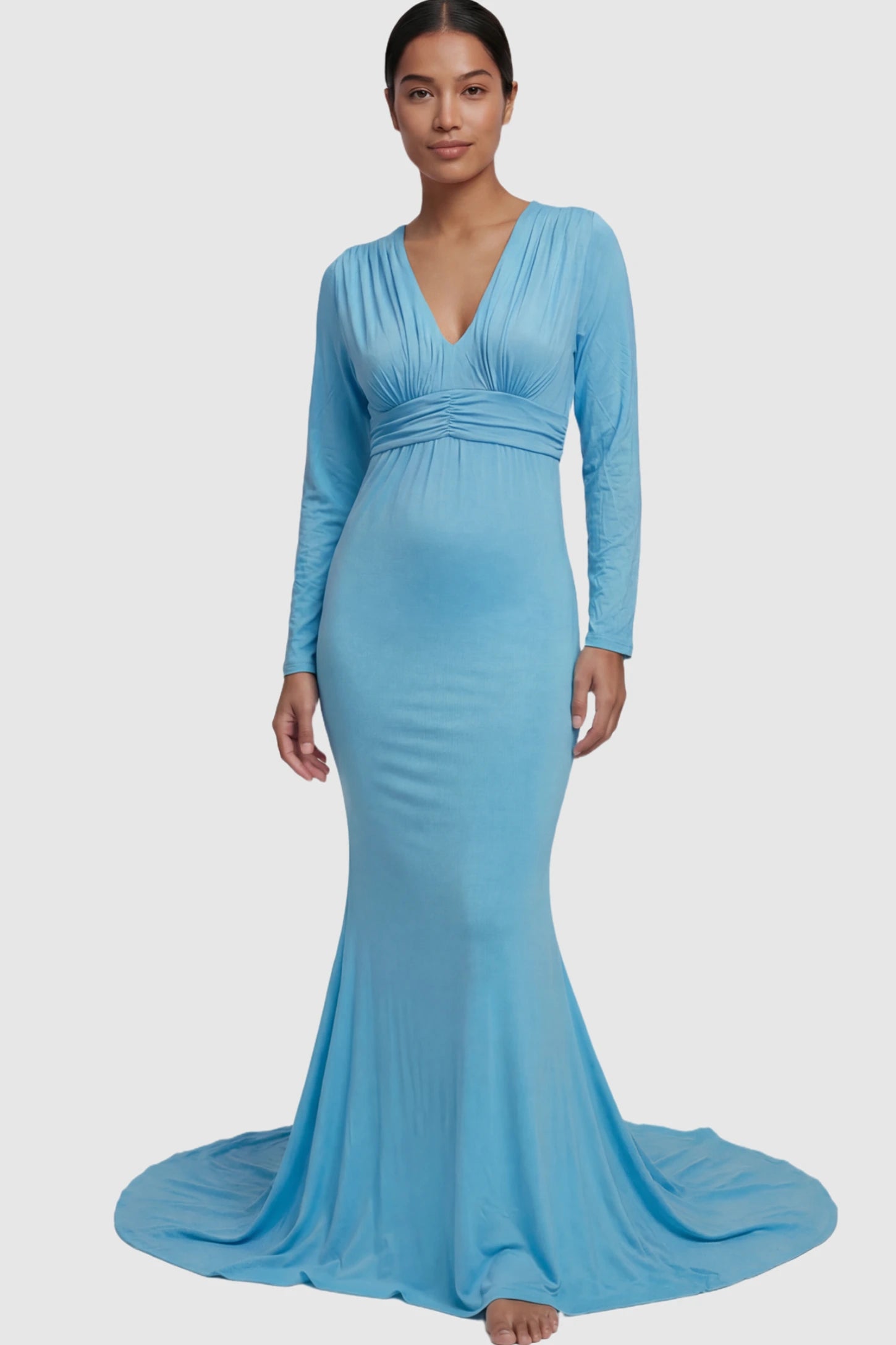 Pure Cotton V-Neck Long Sleeve Maternity Photoshoot Gown Pure Cotton V-Neck Long Sleeve Maternity Photoshoot Gown in Light Blue featuring a floor-pooling train on a postpartum model.