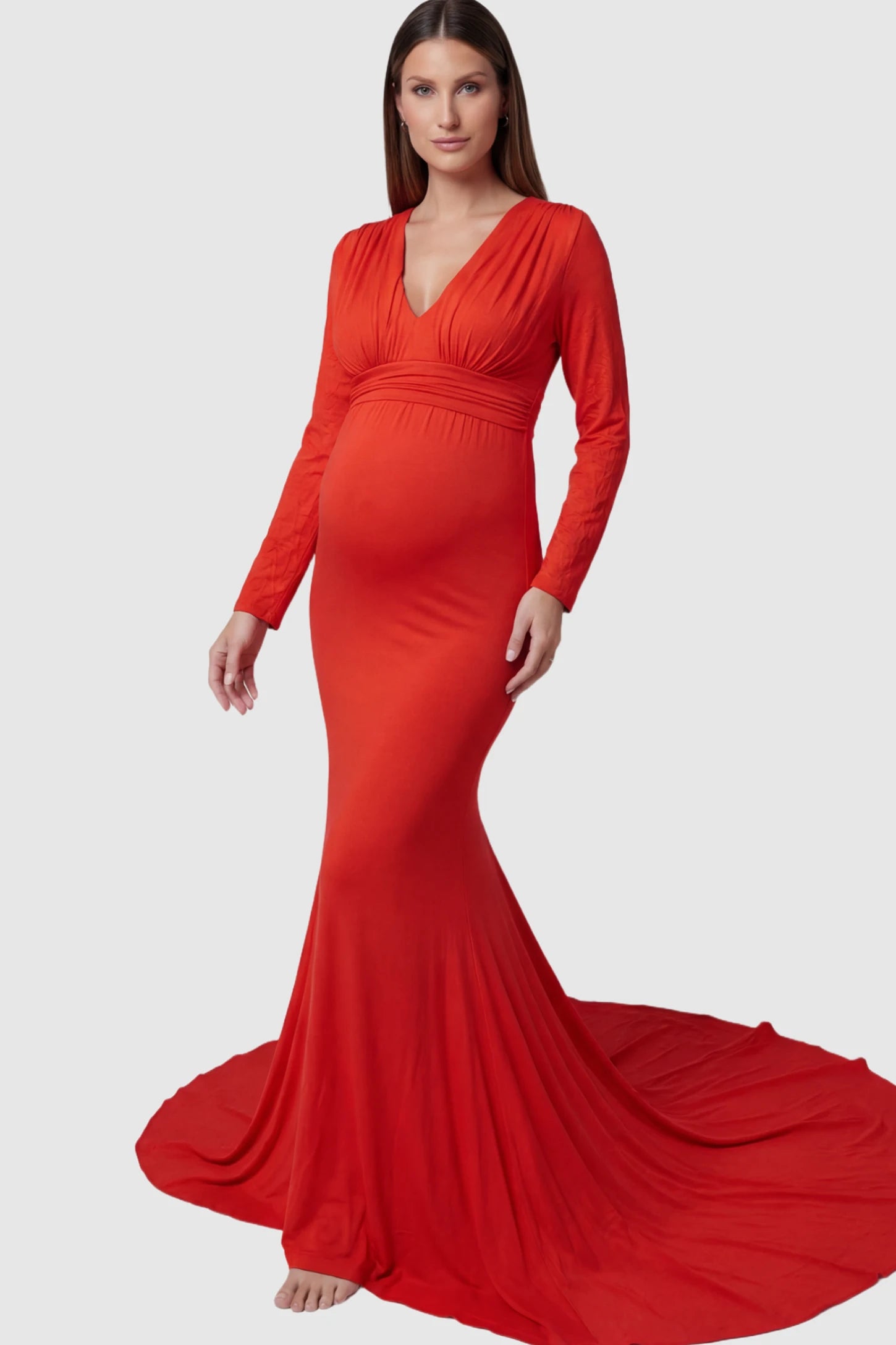 Pure Cotton V-Neck Long Sleeve Maternity Photoshoot Gown Pure Cotton V-Neck Long Sleeve Maternity Photoshoot Gown in Red featuring a floor-pooling train on a pregnant model.