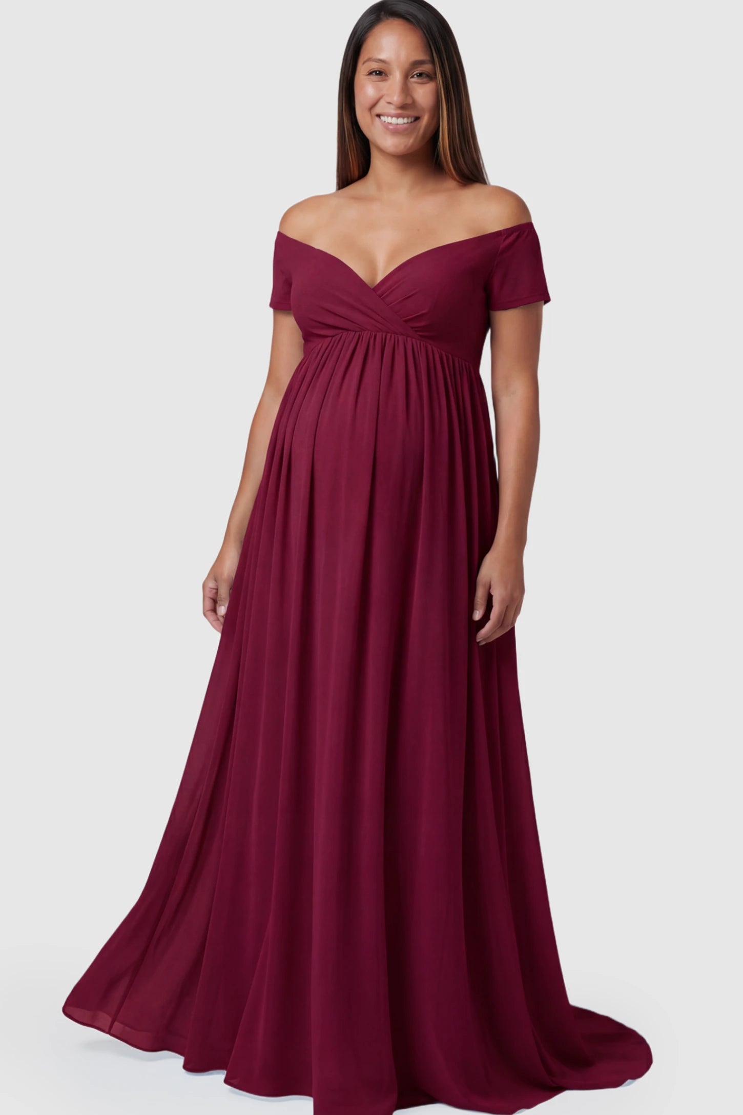 Solid Off-the-Shoulder Sweetheart Maternity Maxi Dress in Wine Red featuring an empire waist on a pregnant model.