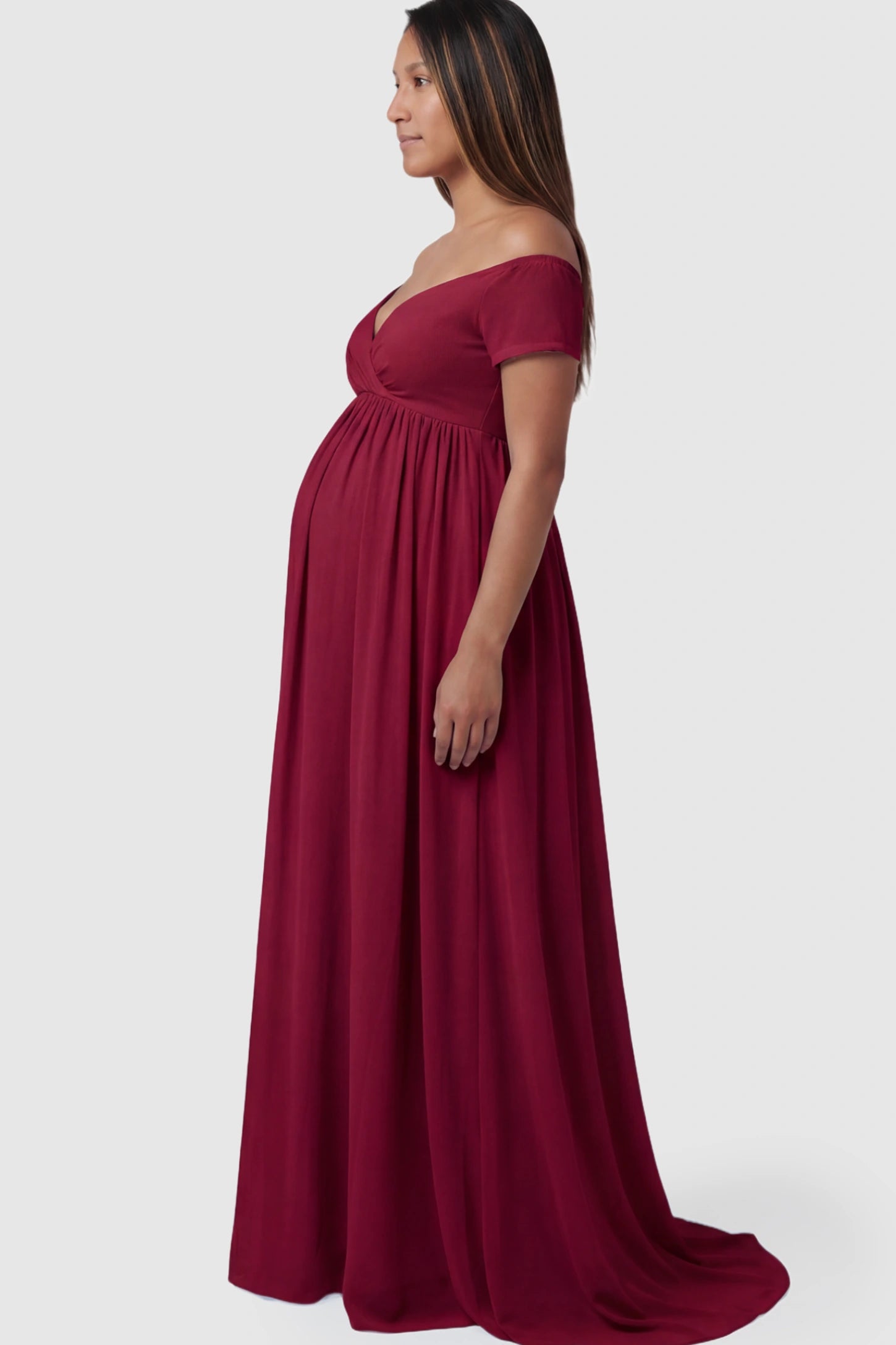 Solid Off-the-Shoulder Sweetheart Maternity Maxi Dress in Wine Red featuring an empire waist on a pregnant model.