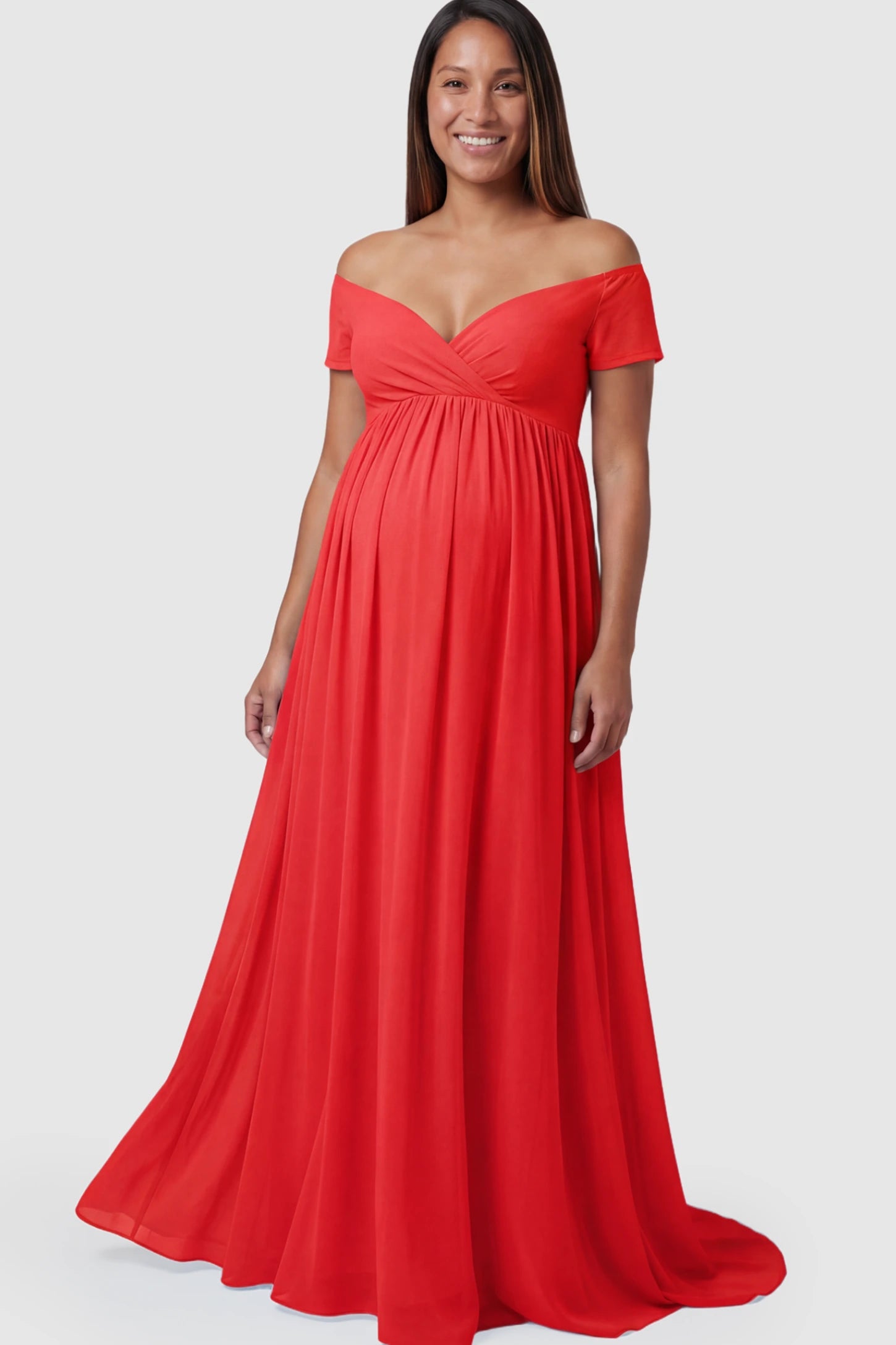 Solid Off Shoulder Flowy Maternity Maxi Dress Solid Off-the-Shoulder Sweetheart Maternity Maxi Dress in Red featuring an empire waist on a pregnant model.