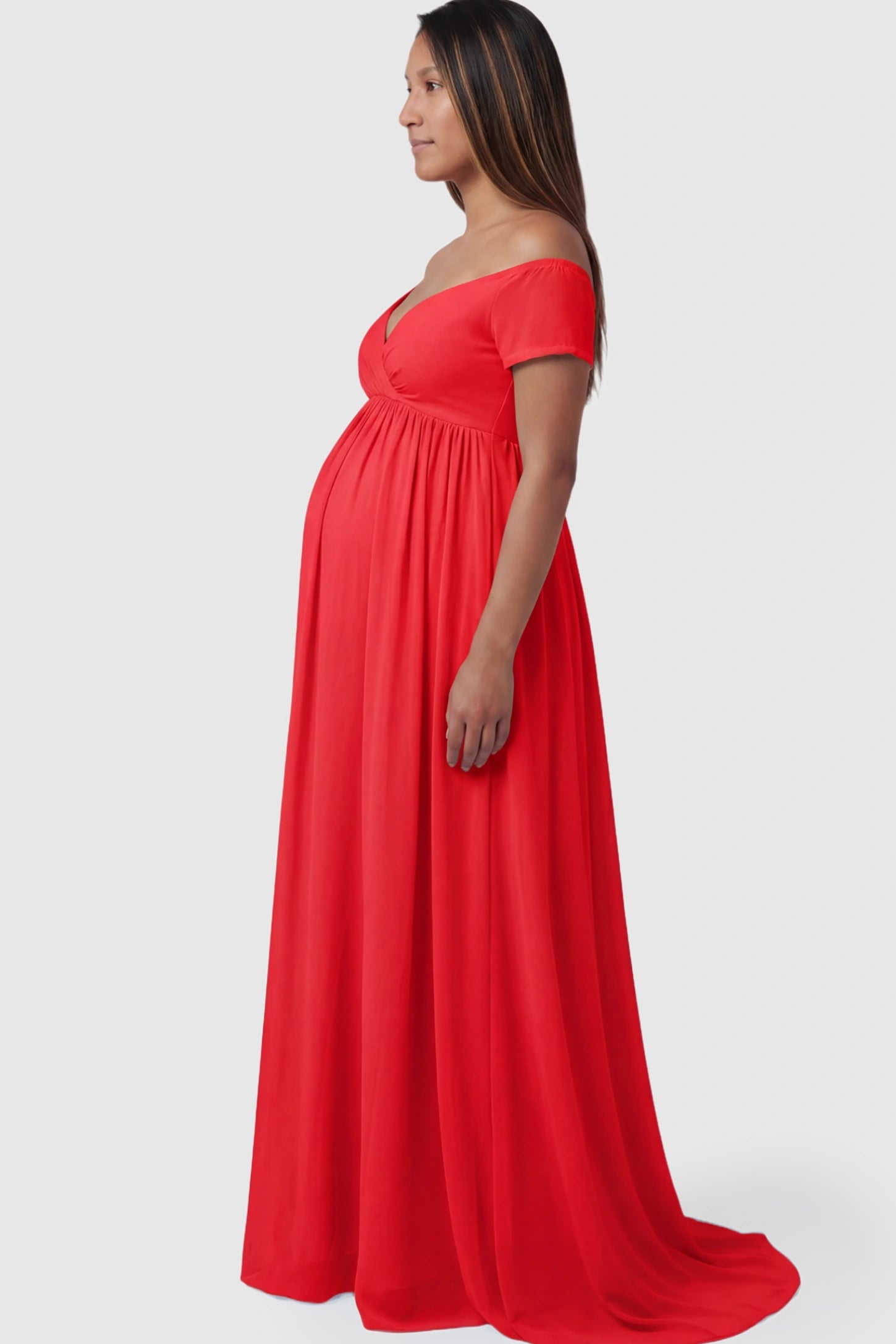 Solid Off Shoulder Flowy Maternity Maxi Dress Solid Off-the-Shoulder Sweetheart Maternity Maxi Dress in Red featuring an empire waist on a pregnant model.