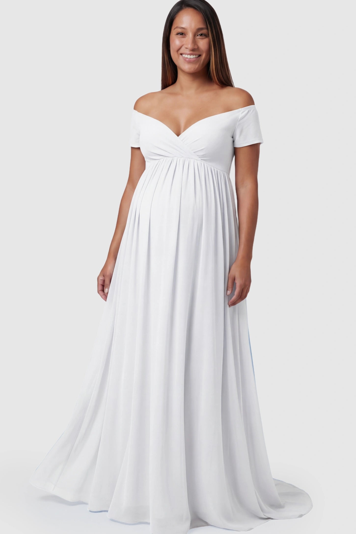 Solid Off Shoulder Flowy Maternity Maxi Dress Solid Off-the-Shoulder Sweetheart Maternity Maxi Dress in White featuring an empire waist on a pregnant model.