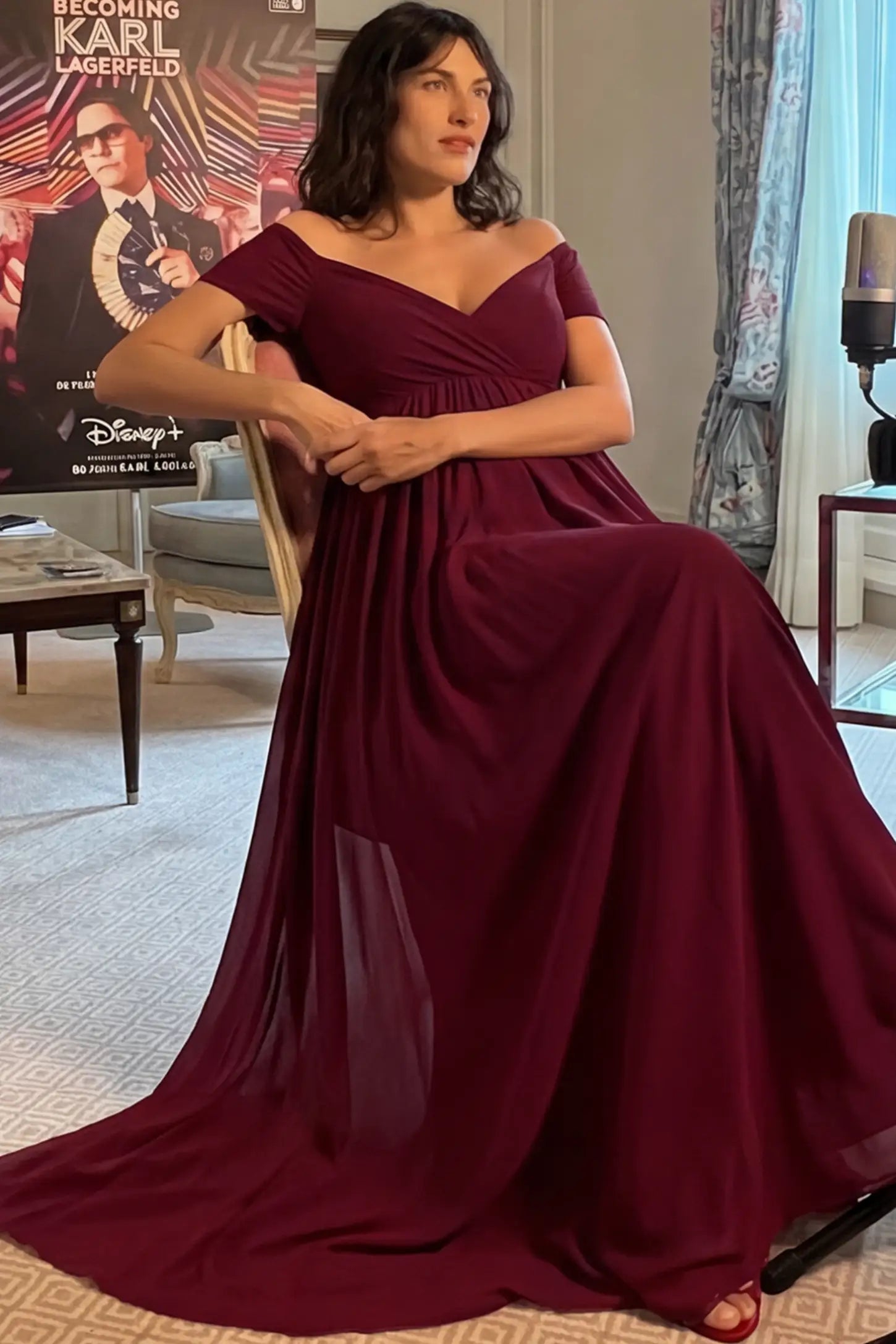 Solid Off Shoulder Flowy Maternity Maxi Dress Solid Off-the-Shoulder Sweetheart Maternity Maxi Dress in Wine Red featuring an empire waist on a pregnant model.