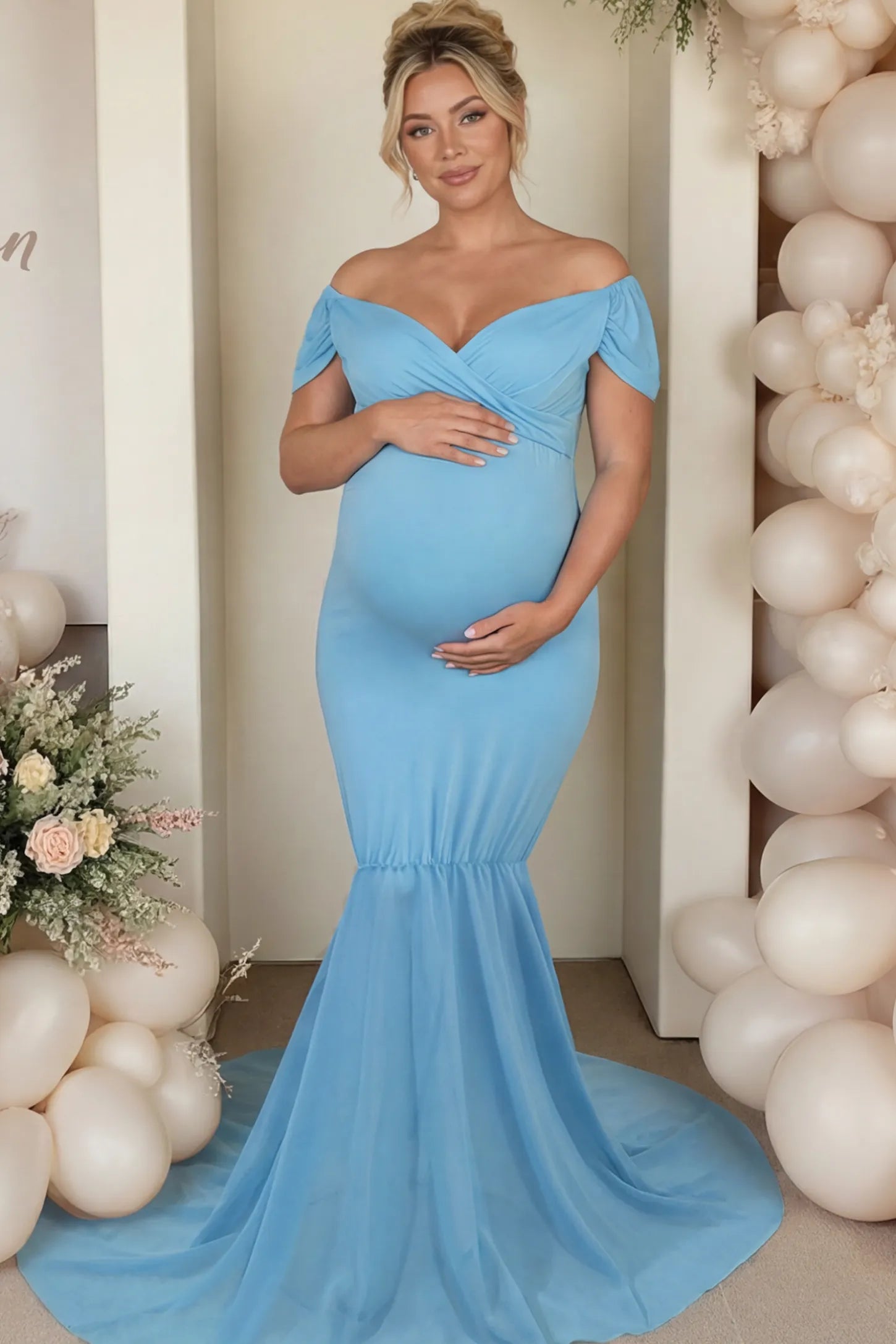 Solid Off Shoulder Fitted Maternity Photoshoot Gown Solid Off Shoulder Fitted Maternity Photoshoot Gown in light blue featuring a sweetheart cross-front bodice and flowing chiffon train on a pregnant model.