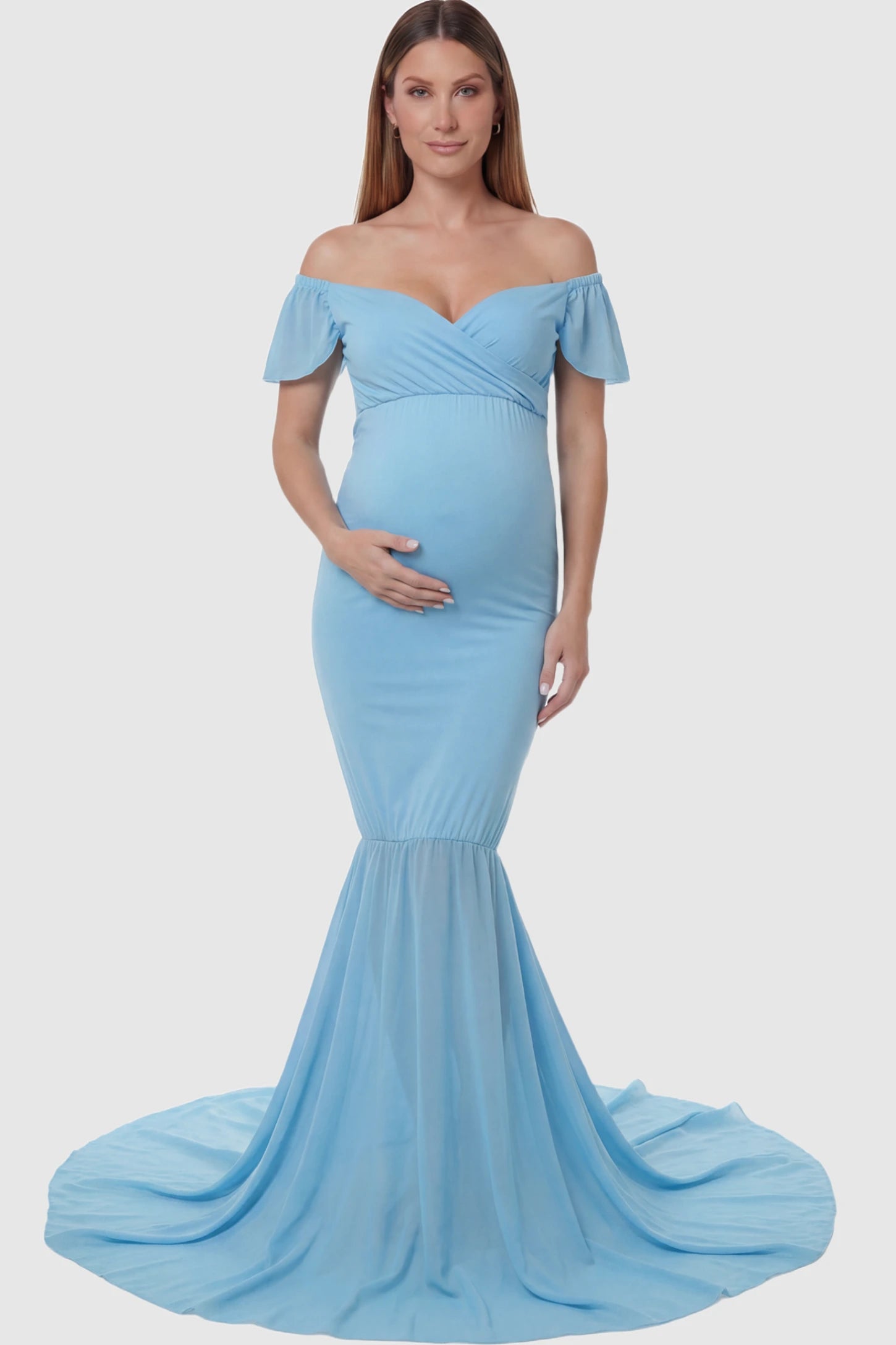 Solid Off Shoulder Fitted Maternity Photoshoot Gown Solid Off Shoulder Fitted Maternity Photoshoot Gown in light blue featuring a sweetheart cross-front bodice and flowing chiffon train on a pregnant model.