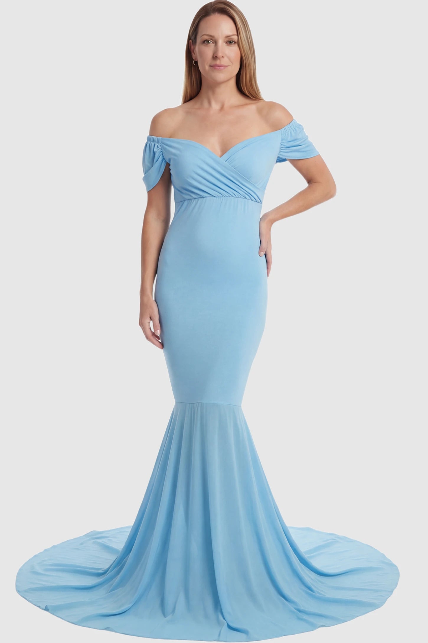 Solid Off Shoulder Fitted Maternity Photoshoot Gown Solid Off Shoulder Fitted Maternity Photoshoot Gown in light blue featuring a sweetheart cross-front bodice and flowing chiffon train on a postpartum model.